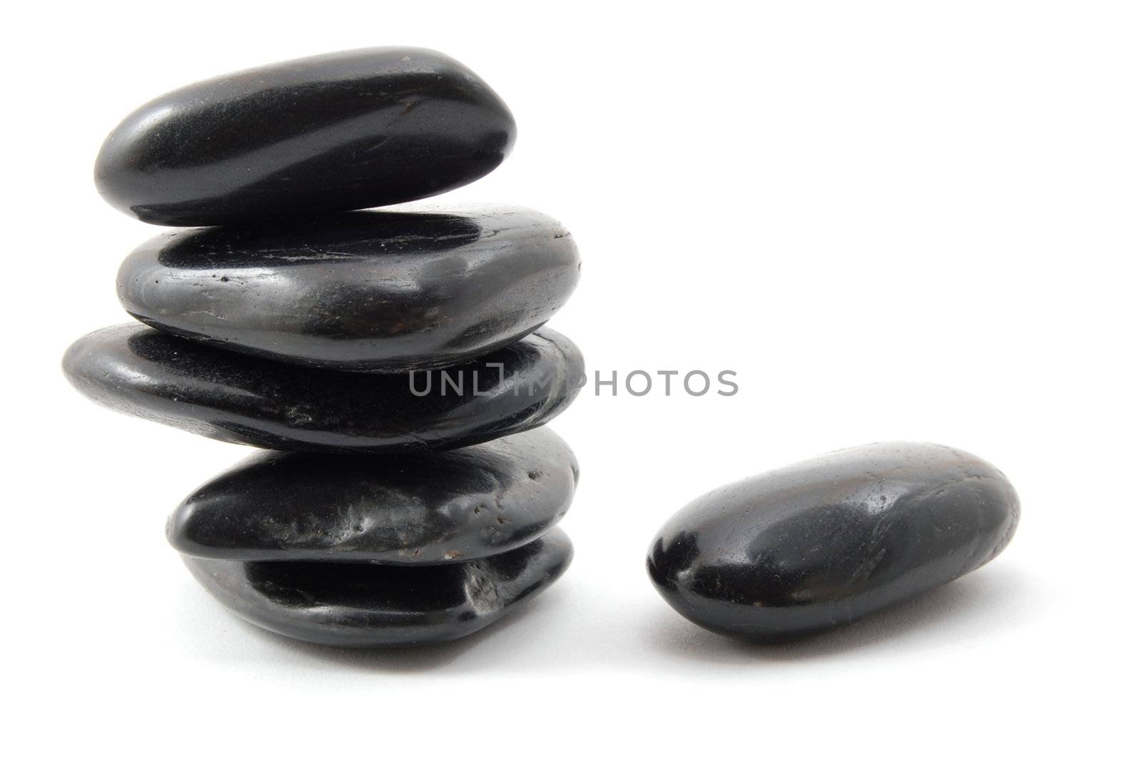 black stones in balance isolated on white background