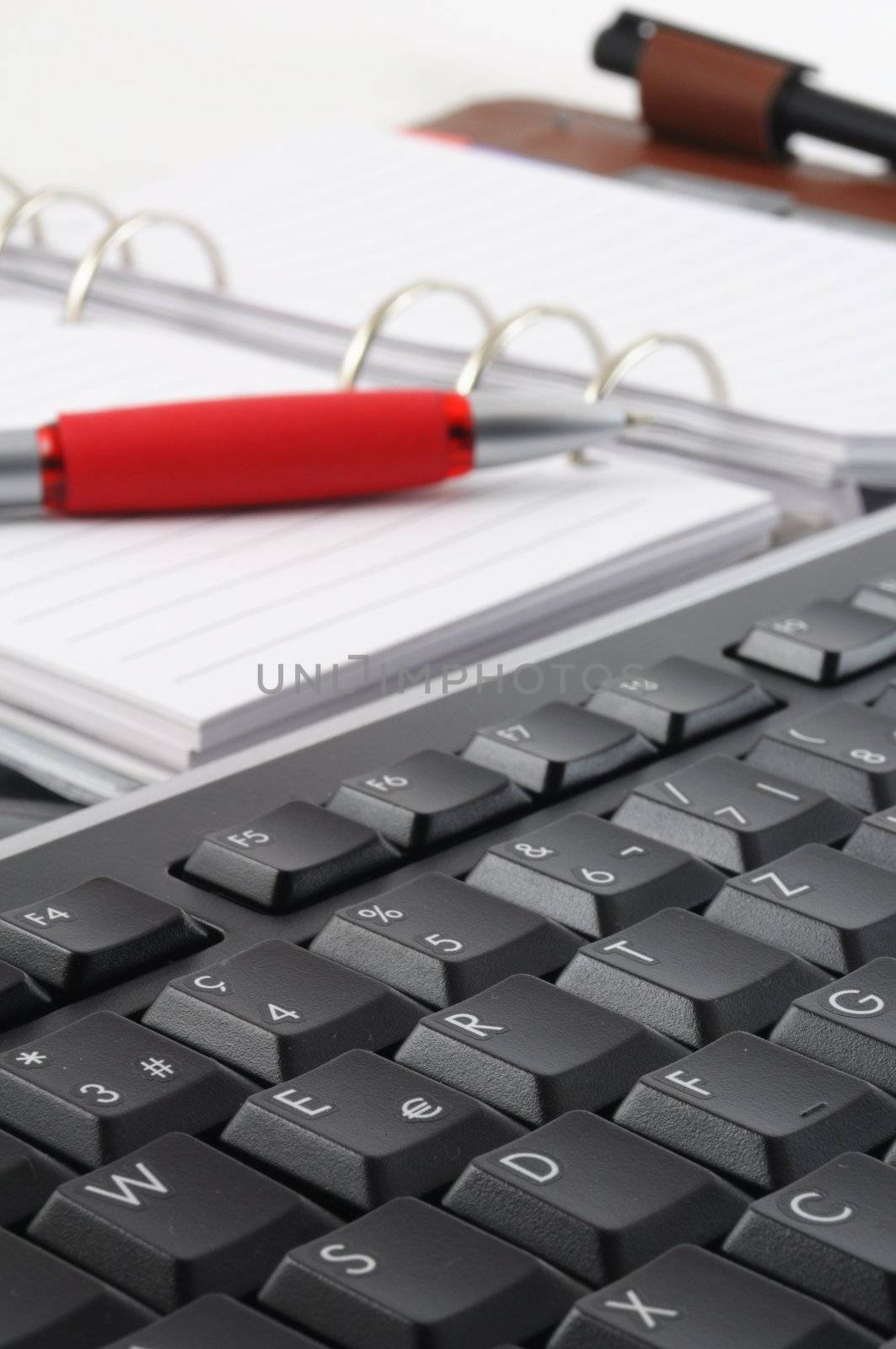 keyboard and paper on a desk in the office