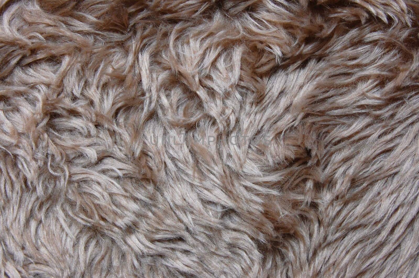 brown cuddly fur textile texture which can be used as background