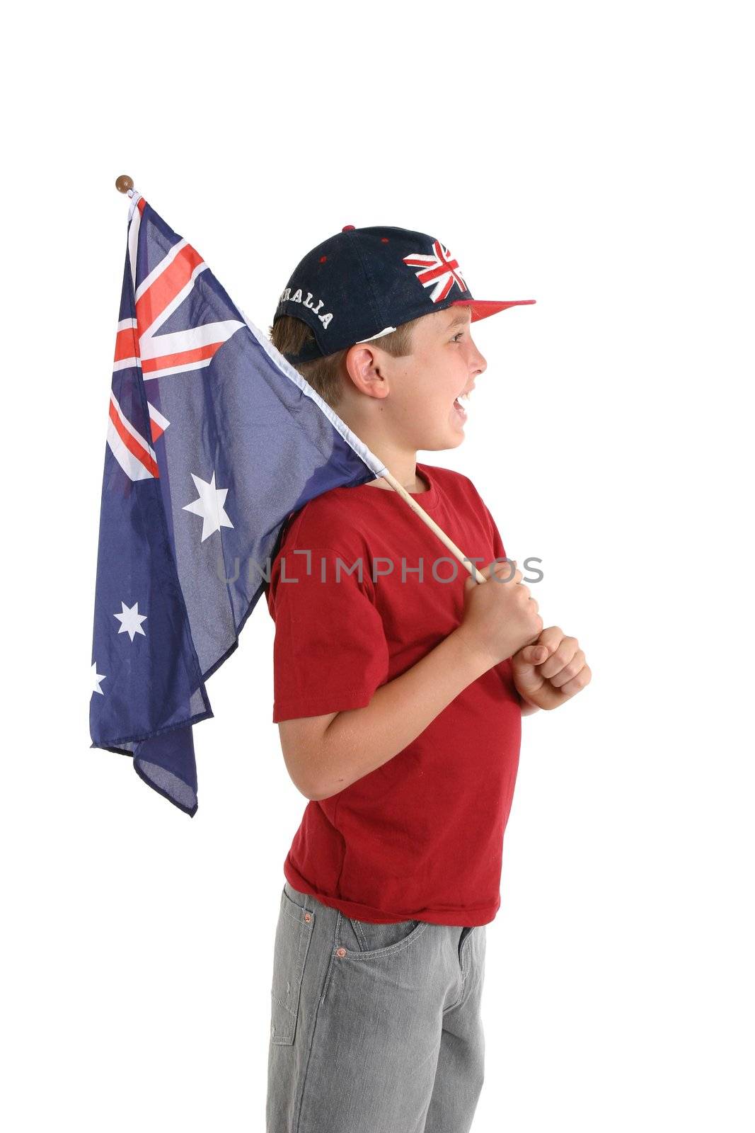 An Australian boy holding a flag and facing sideways.