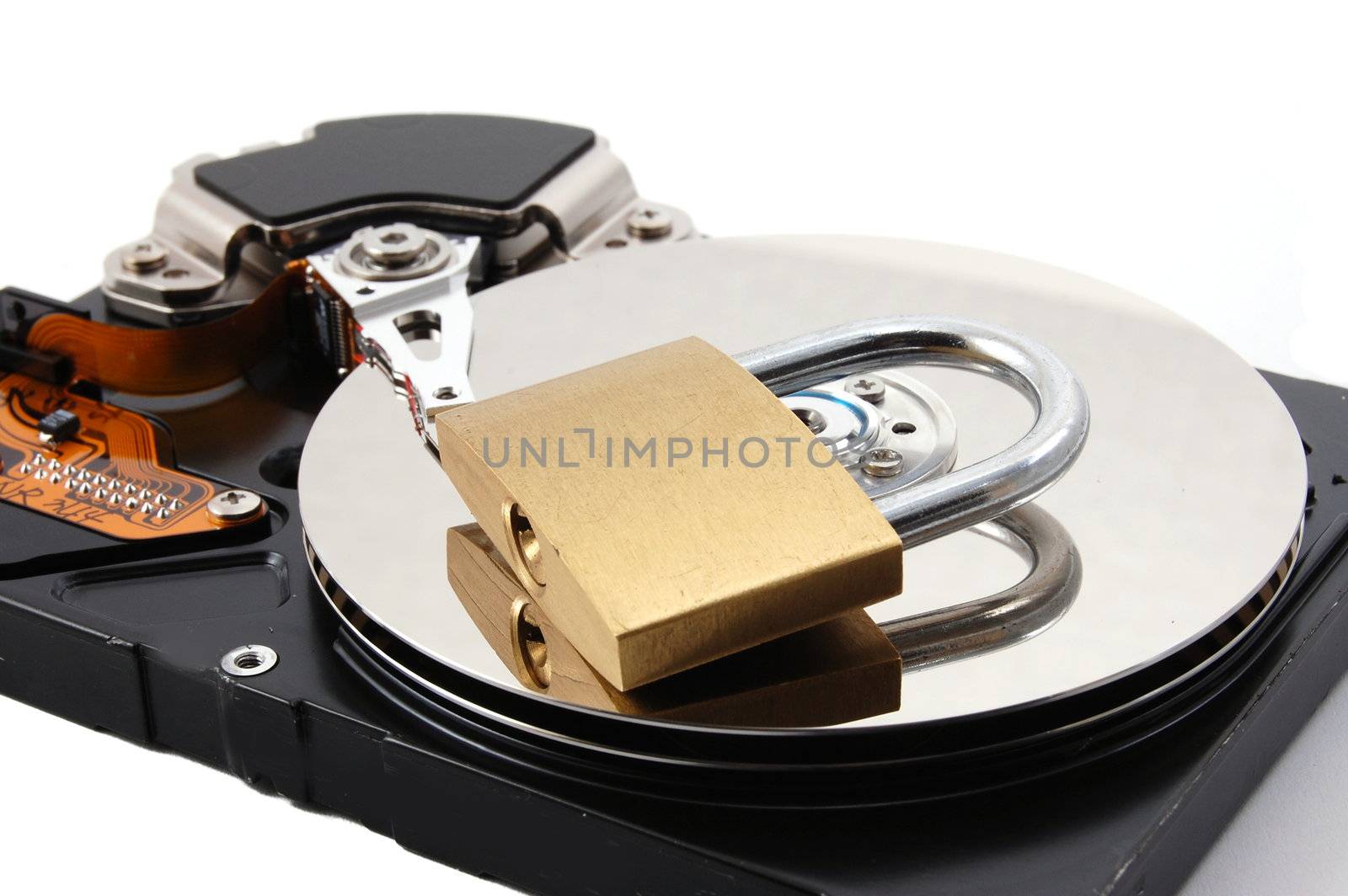 computer hard disk drive and a padlock isolated on white background