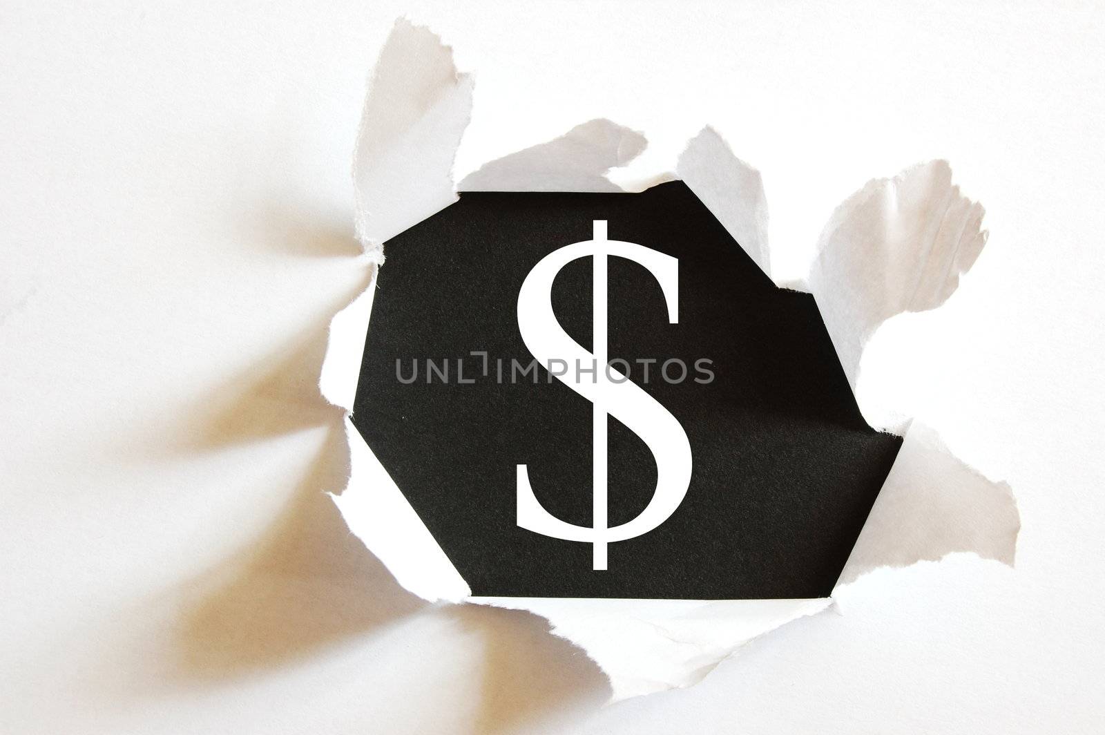 money concept with hole in paper and black background