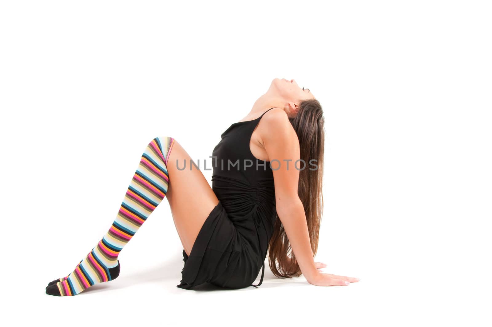 Shot of woman in multicolored stockings sitting onthe floor