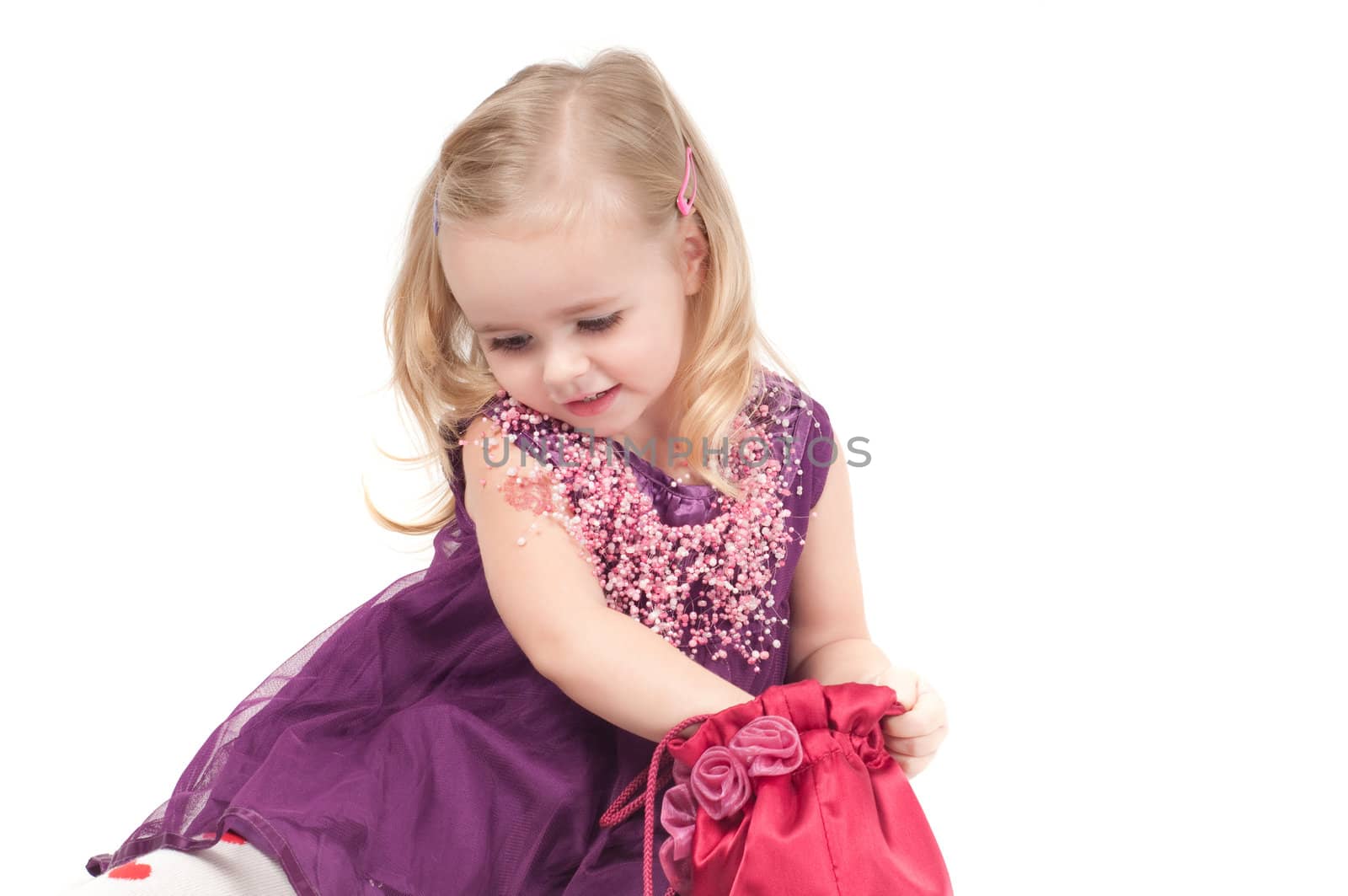 Studio shot of baby girl in lilac gala dress