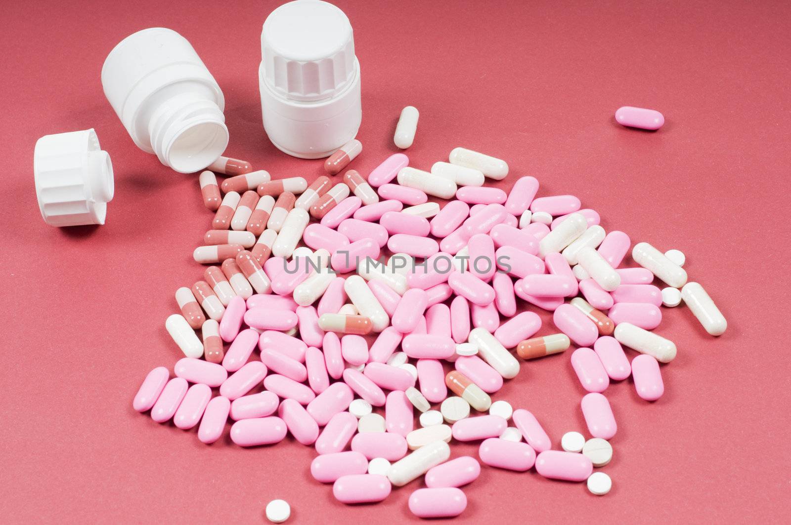 Studio shot of pills on red backgroung