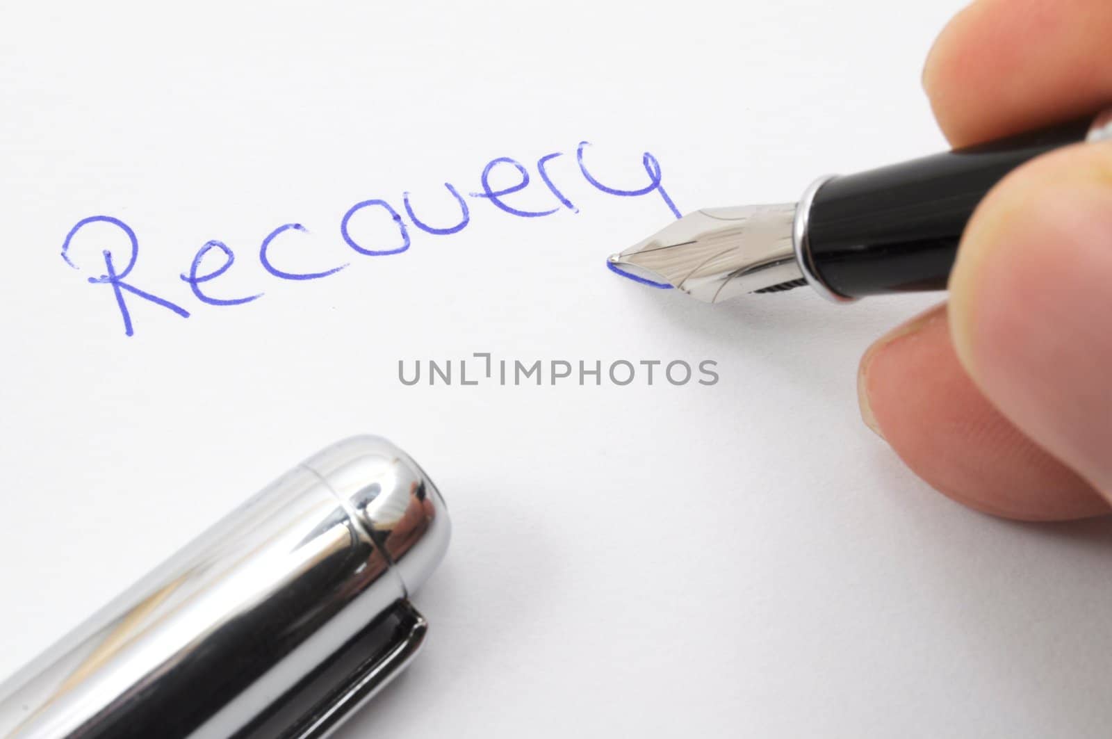 recovery concept with word written on paper and pen