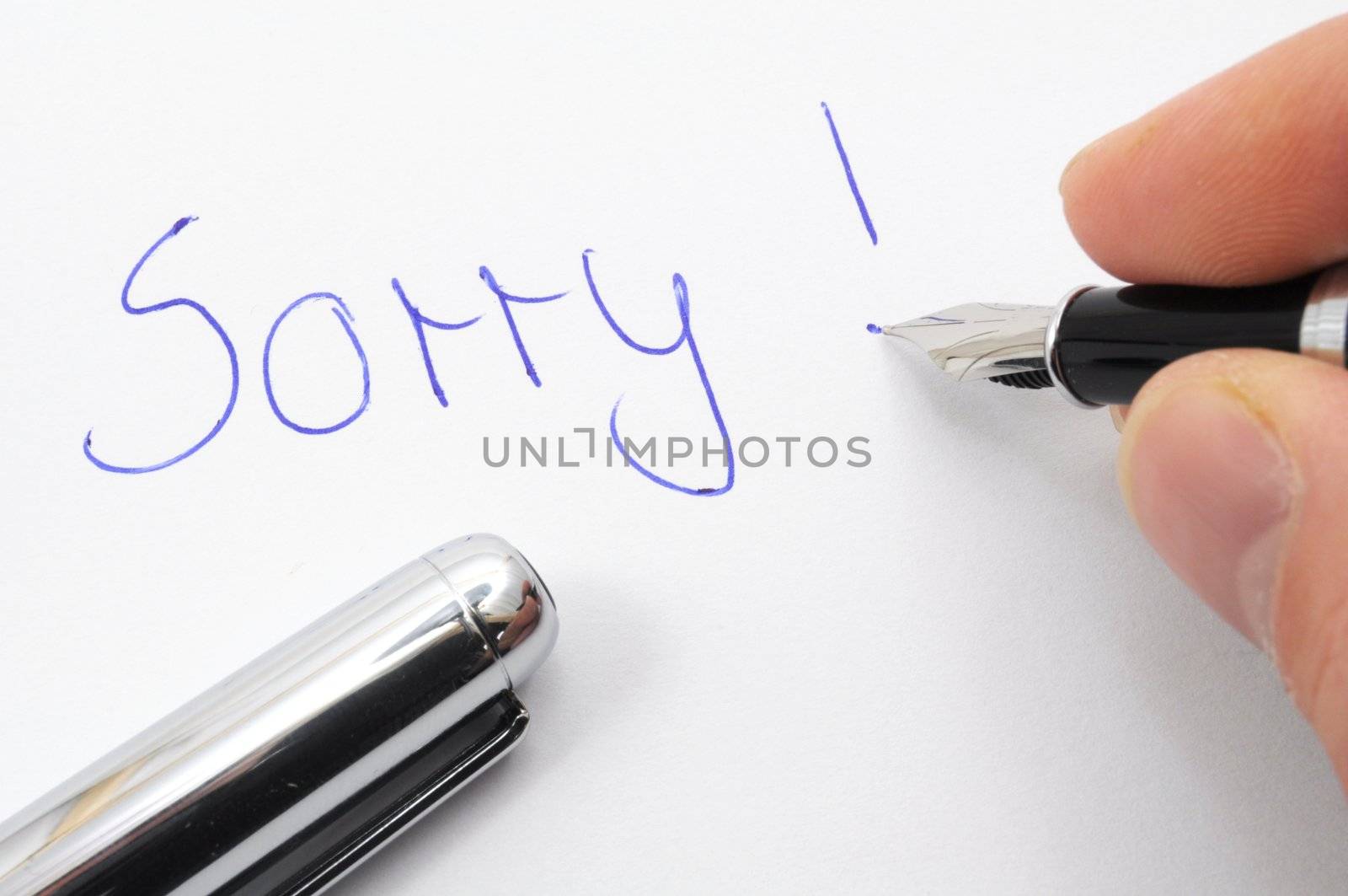 say sorry with a text message on paper and pen
