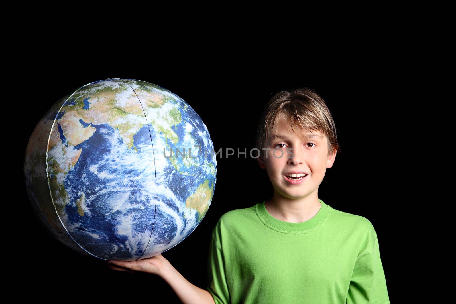 A young boy holding the earth world ball in his hand against a black background.  Images from Nasa.