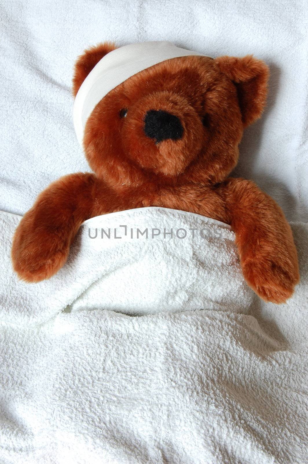sick teddy with injury in bed by gunnar3000