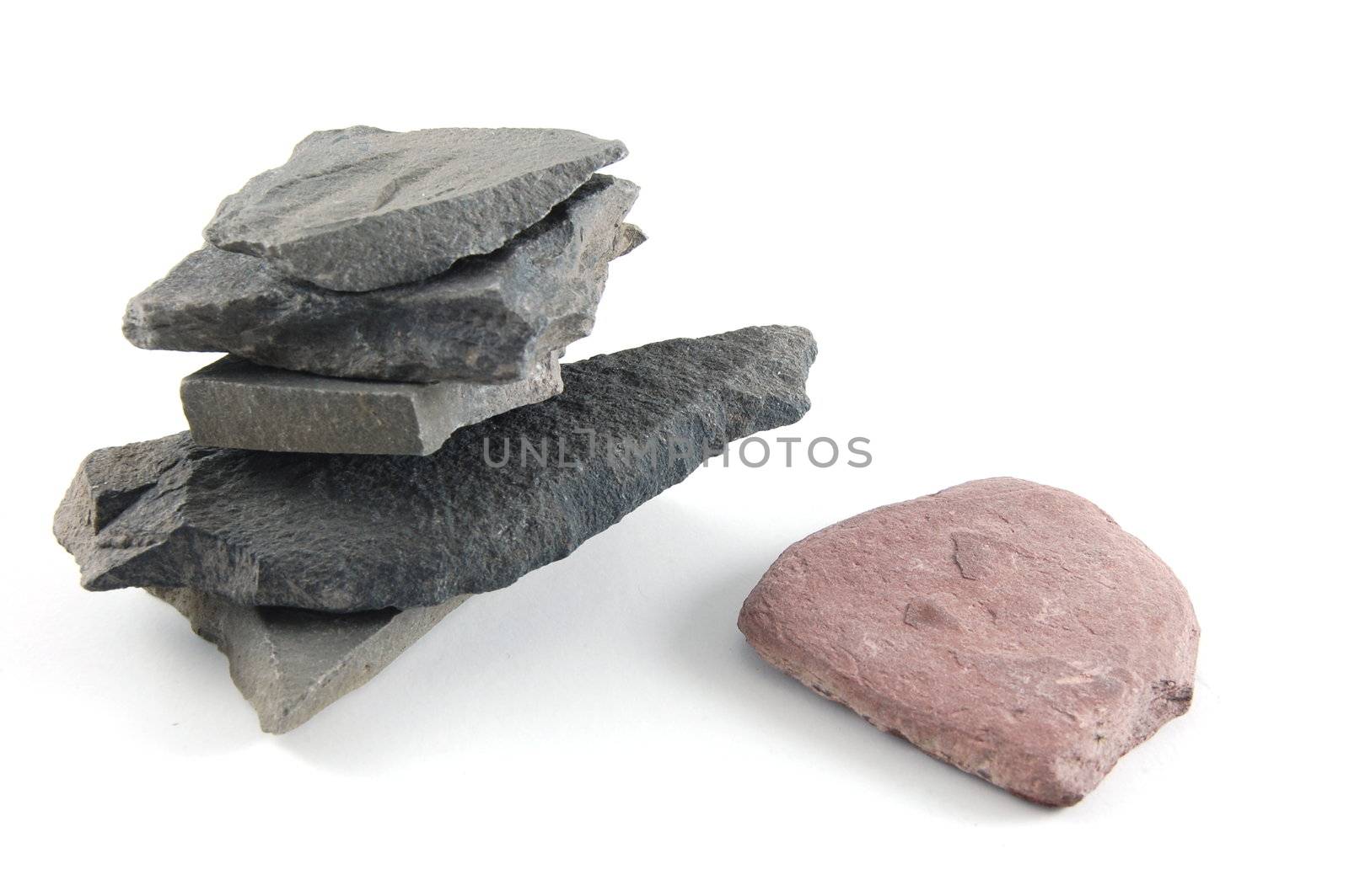 A tower made of stones isolated on a white background.