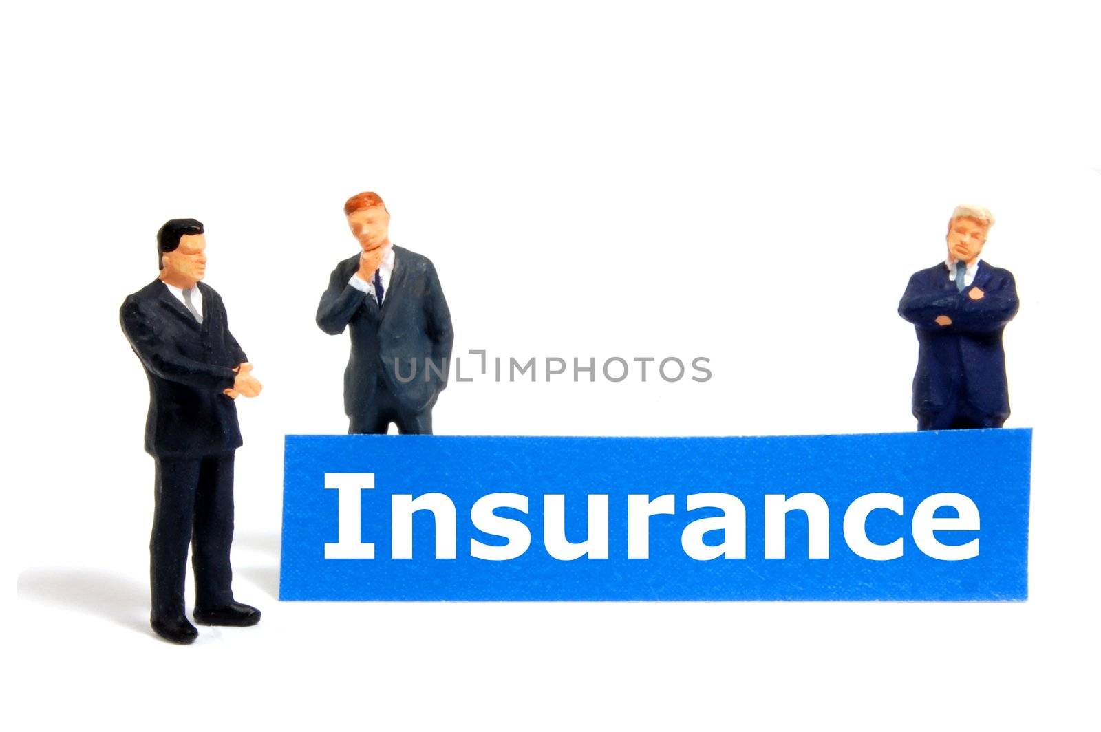 insurance concept with small toy business man isolated on white background