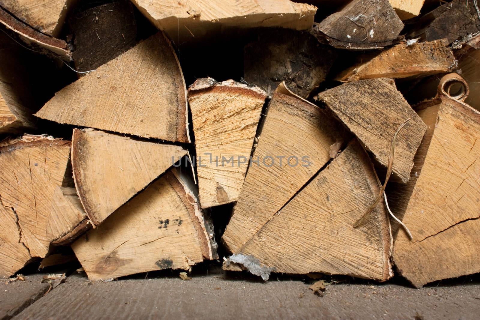 Stack of chopped firewood prepared for burning. End view.