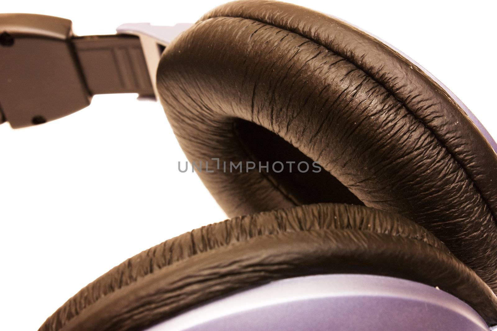 Close up image. Soft black pad of headphones isolated on white.