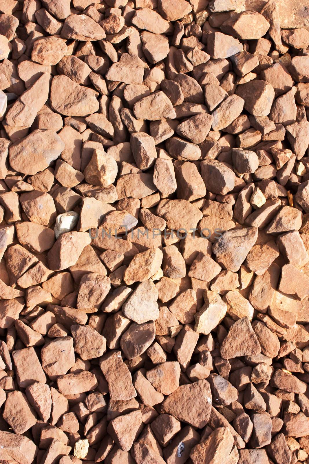 Rusty rocks around railroad in hot summer