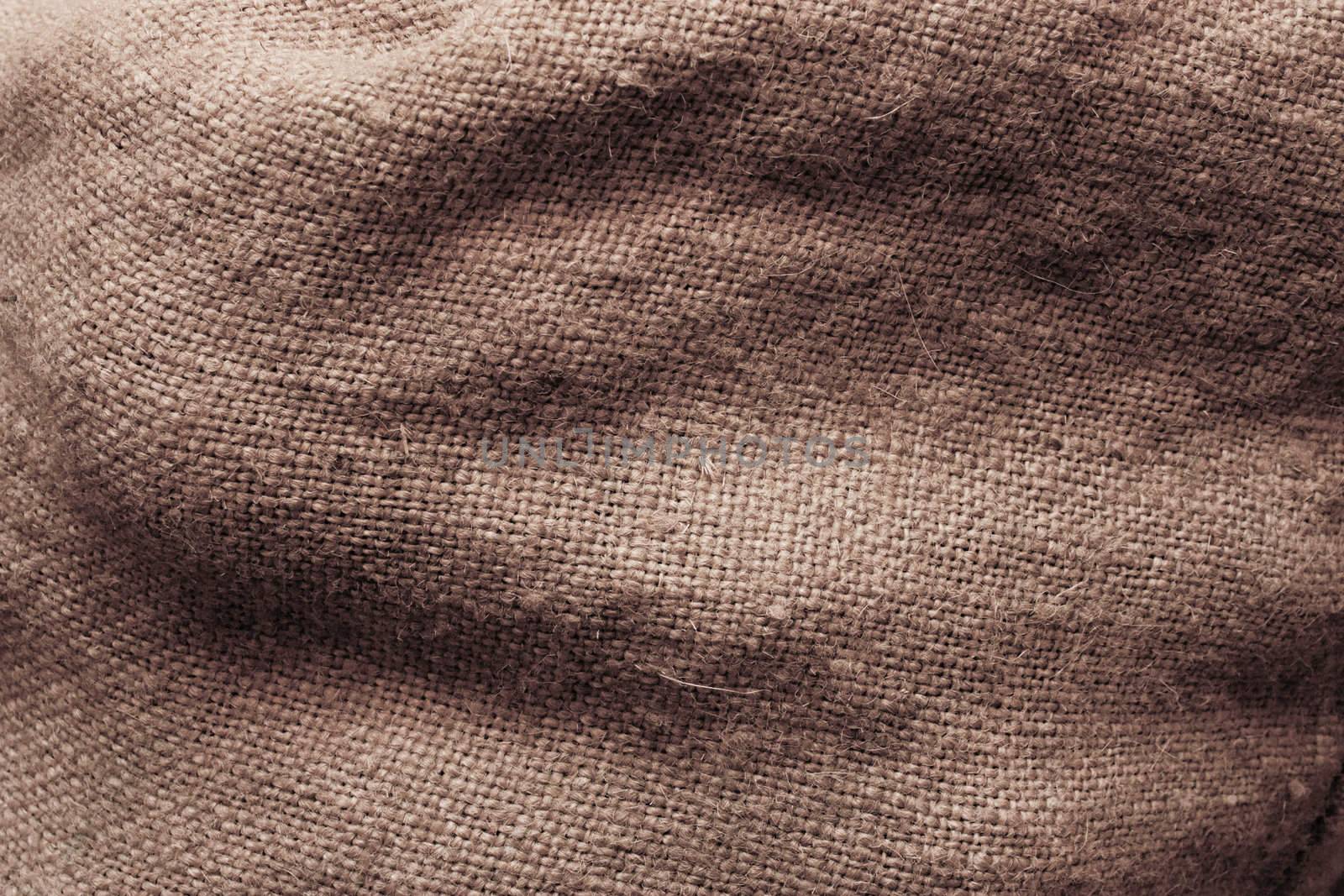 Surface of a sack filed with potatoes. Texture.