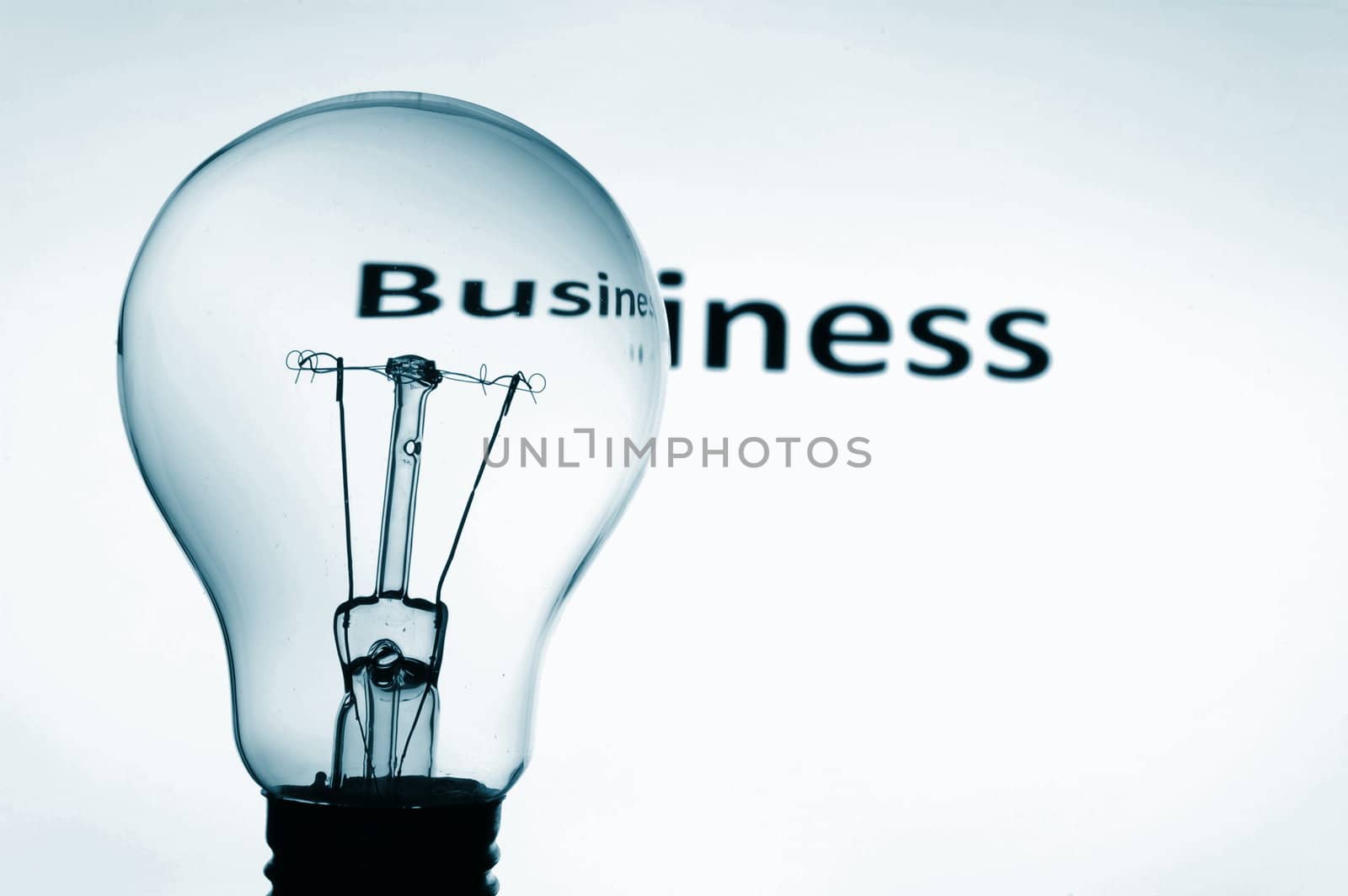 bulb on blue background showing business concept with copyspace