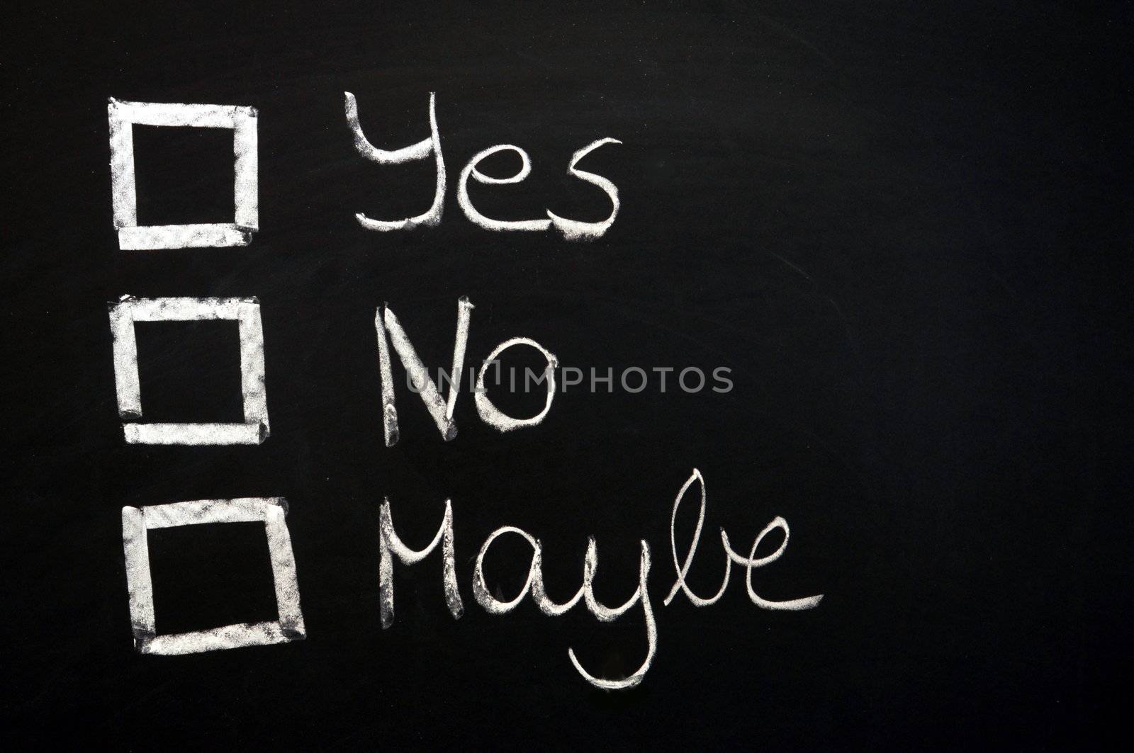 vote yes or no written on chalkboard or blackboard