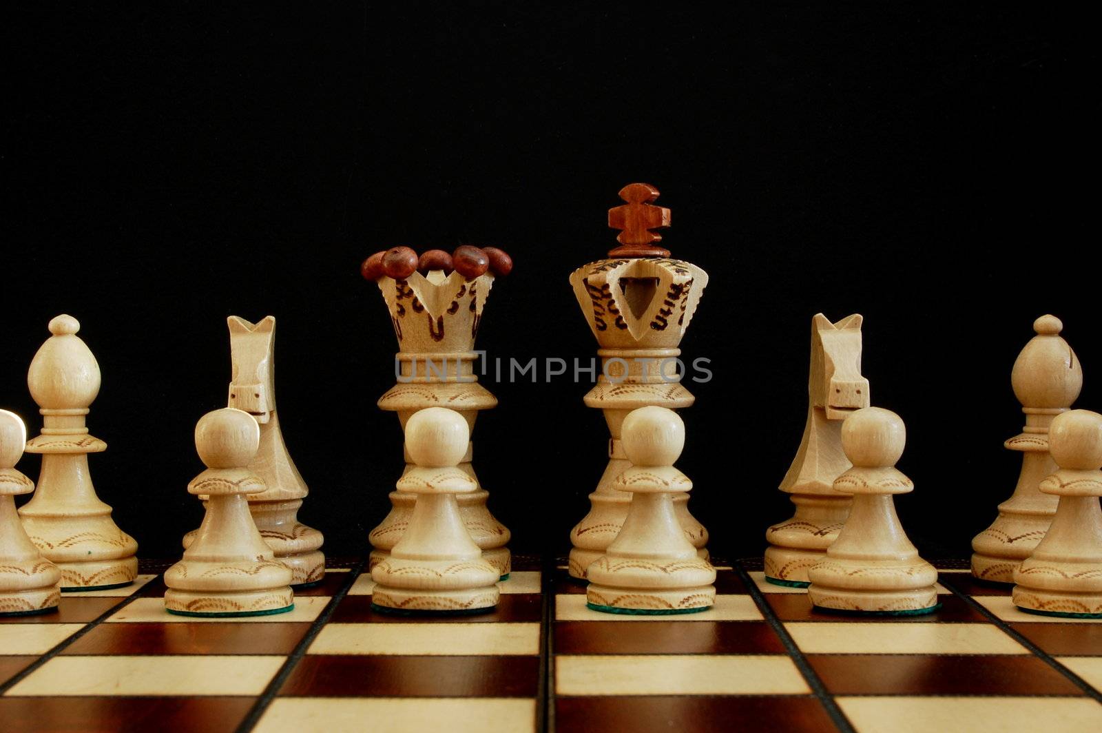 chess pieces showing power competition conflict and strategy in business