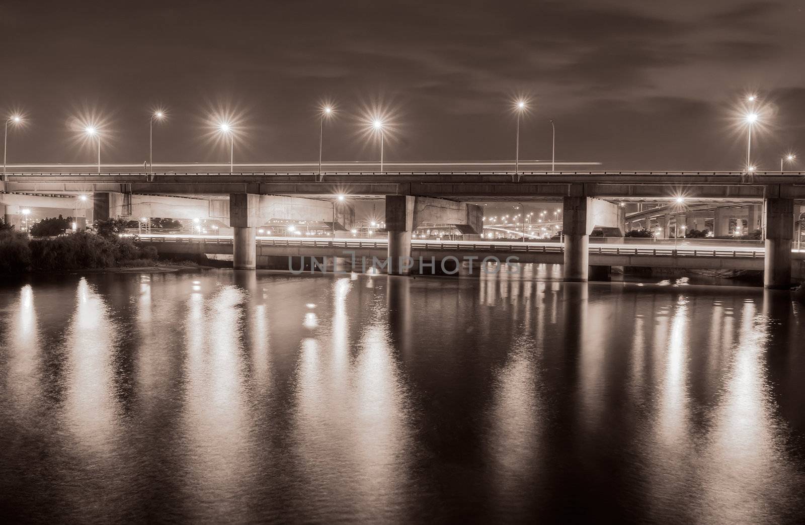 Bridge on the river in the evening of Taipei city night.