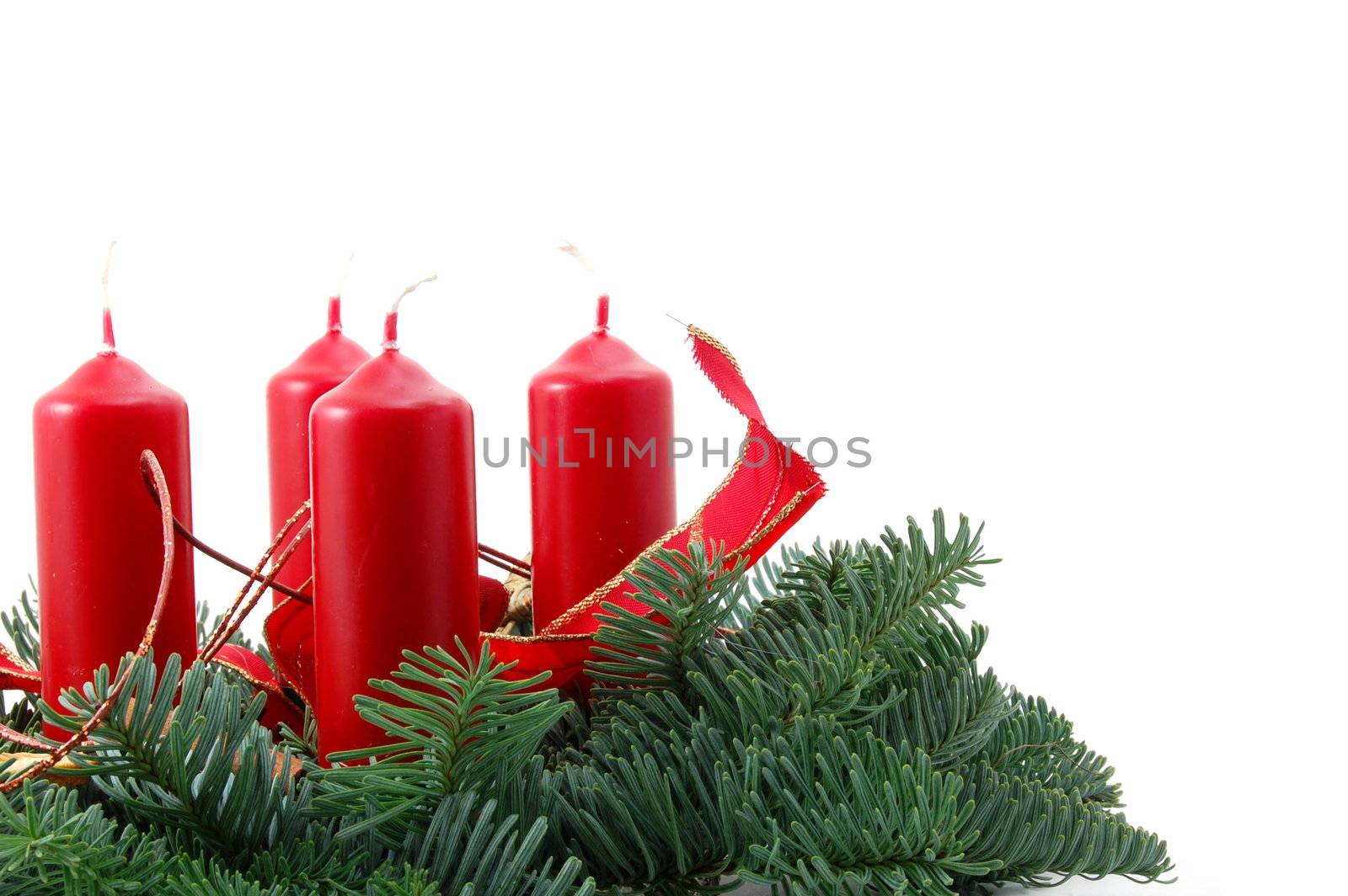 christmas wreath isolated on white background with red candles