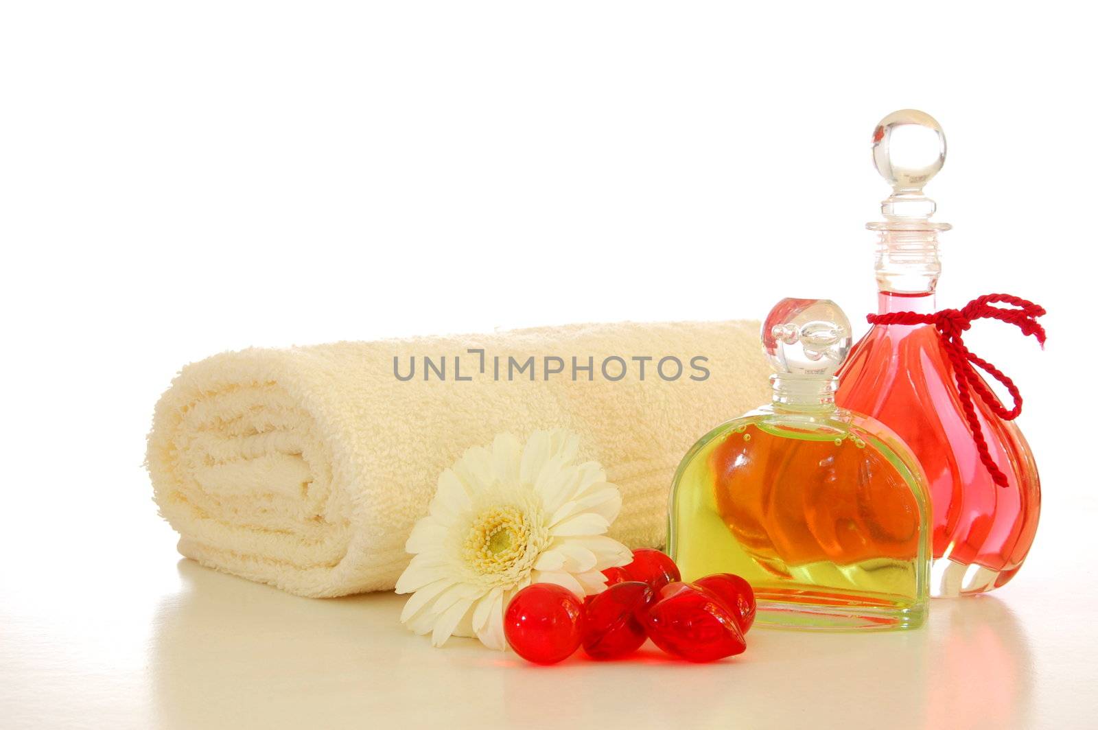 bottle with massage oil isolated on white background