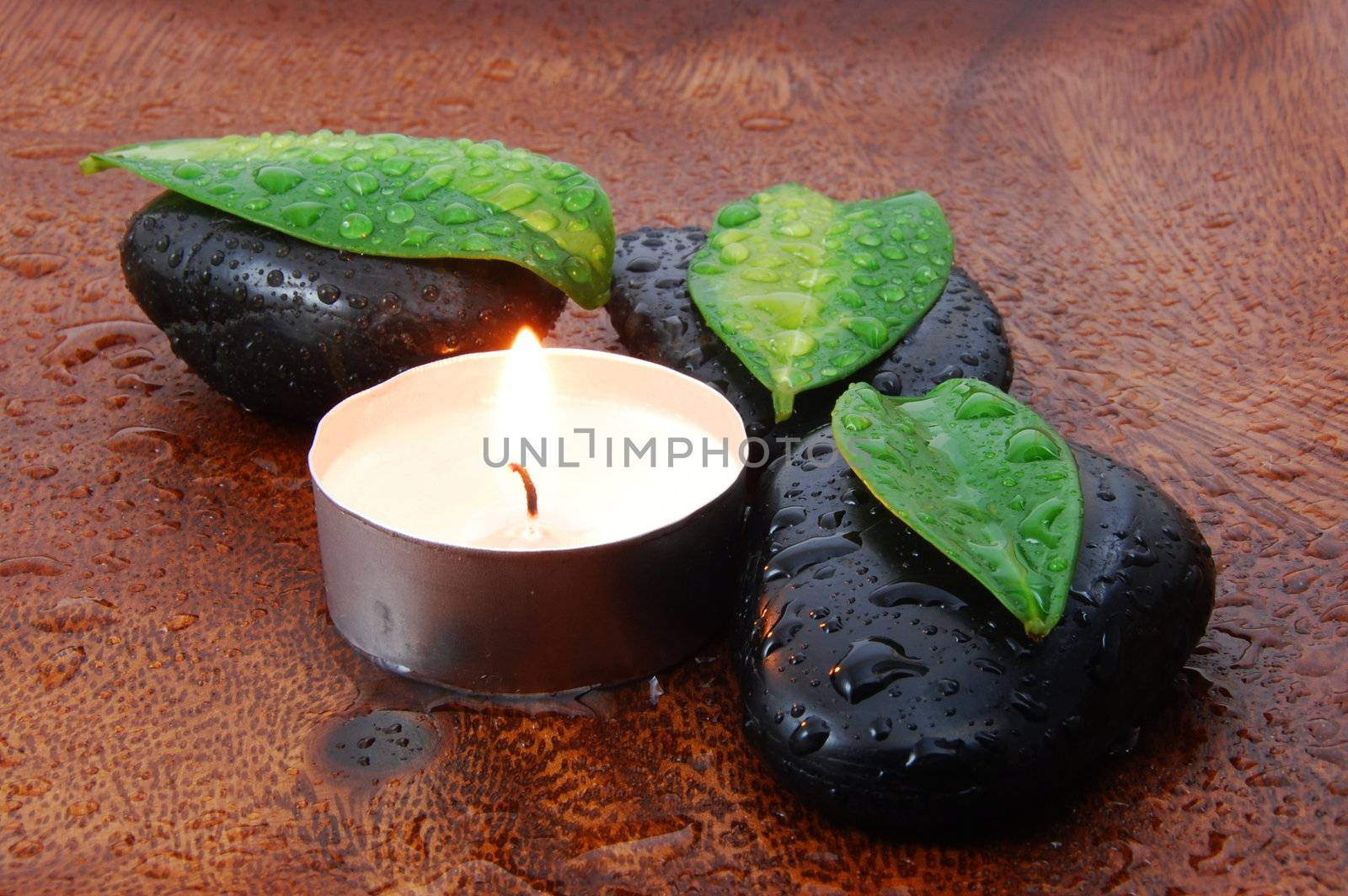 zen stones and leaves showing a wellness or bath concept