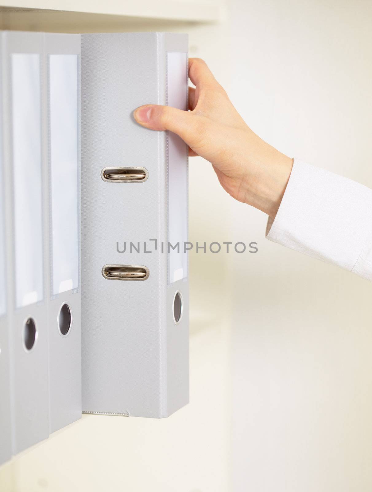 Folder with archival documents and a hand of the clerk