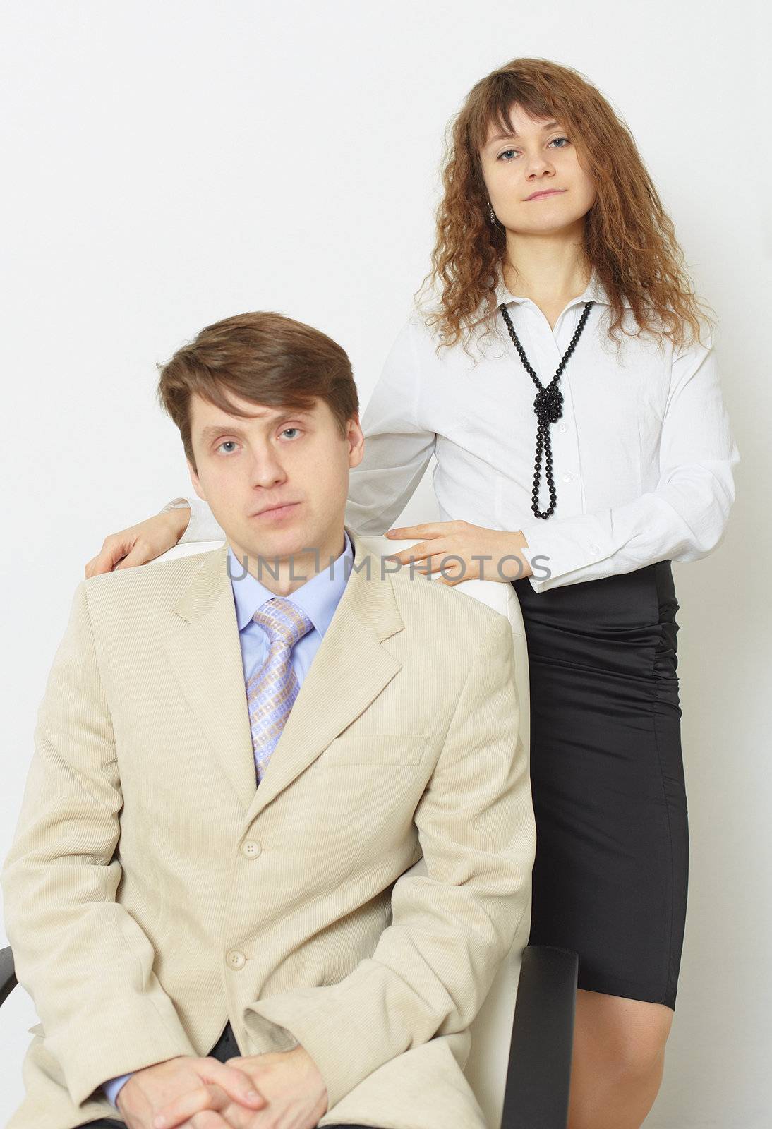 The serious man in a jacket and a tie and its woman