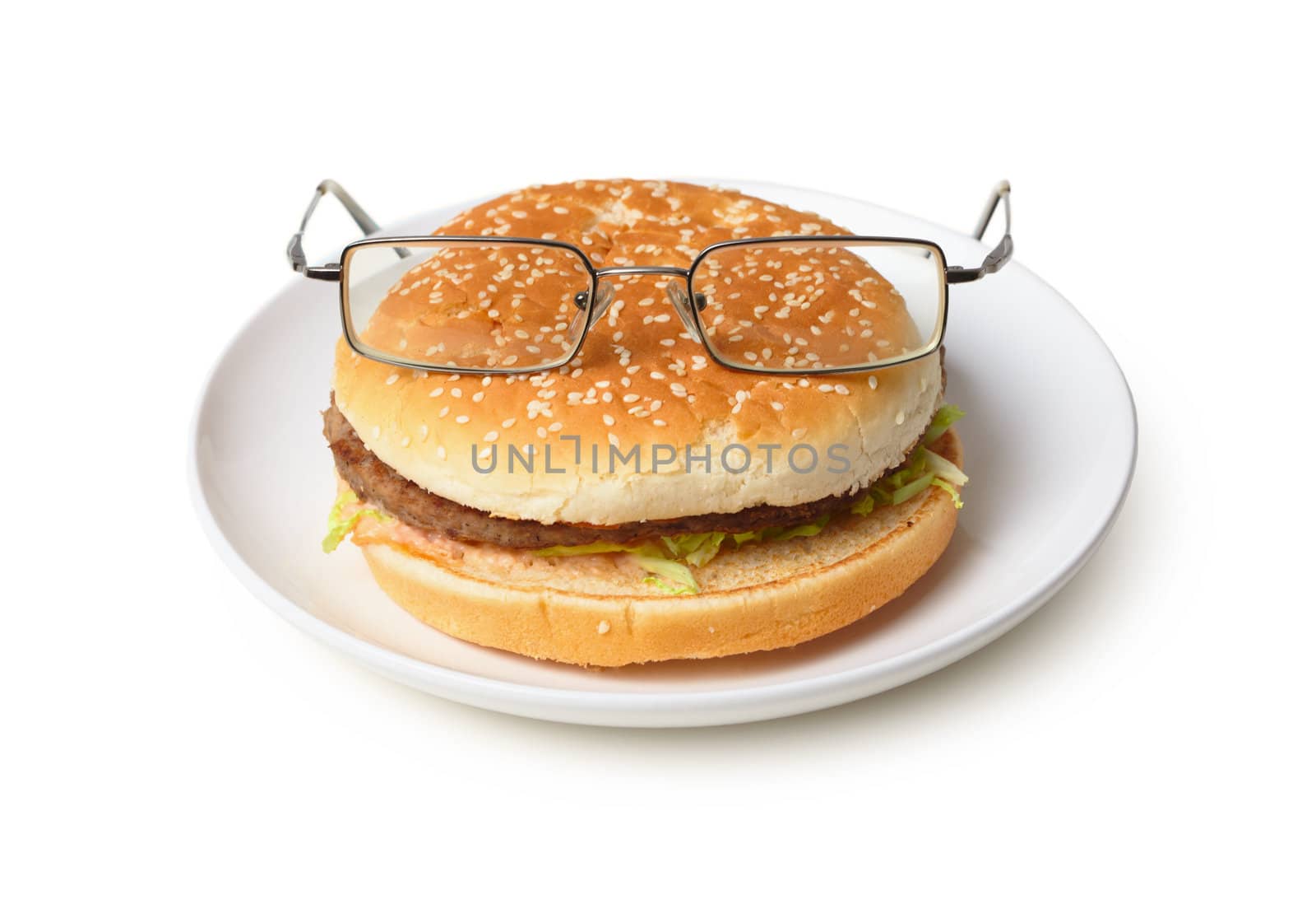 Amusing hamburger in spectacles on a plate isolated on a white background