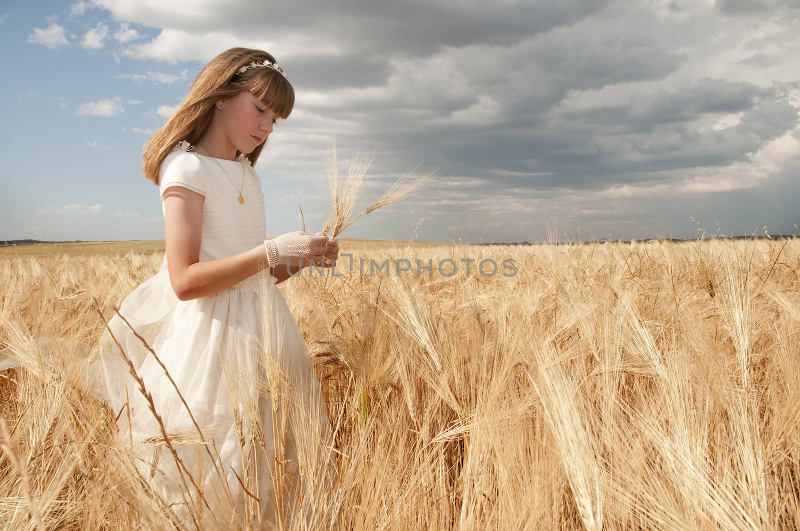 communion dress girl in the field