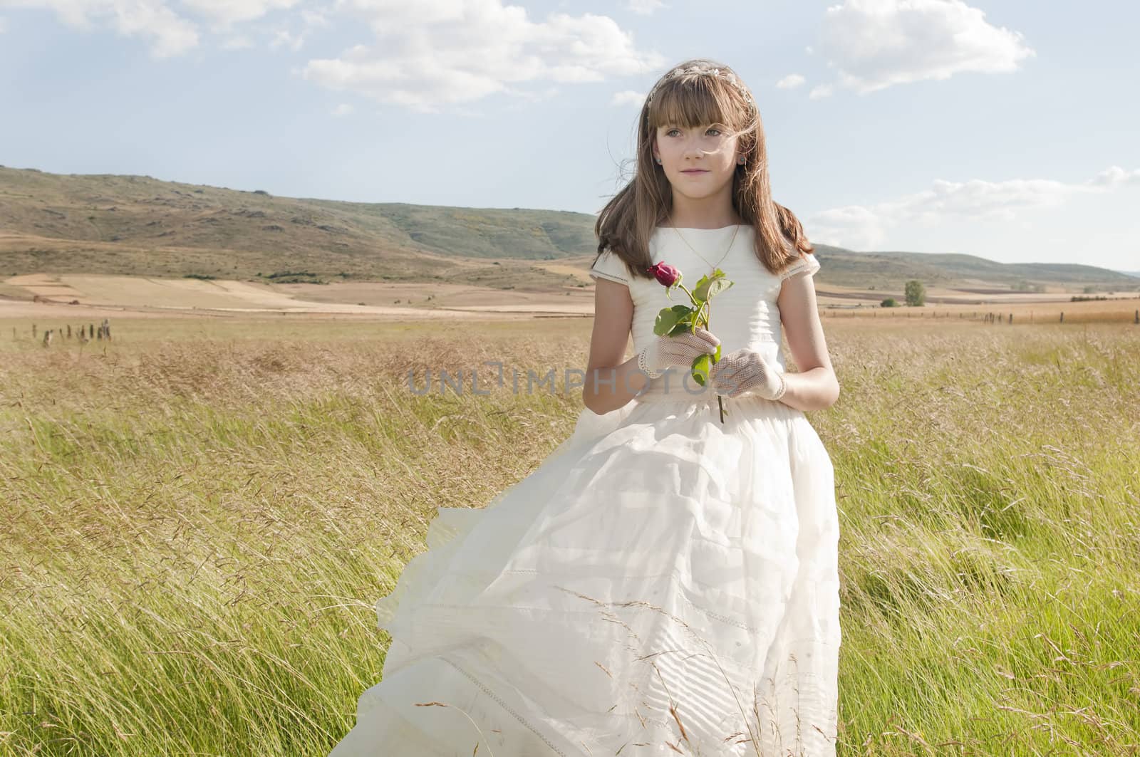 communion dress girl in the field