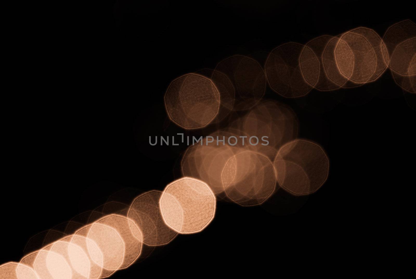 Beautiful yellow blurred spot light arrange in a line.