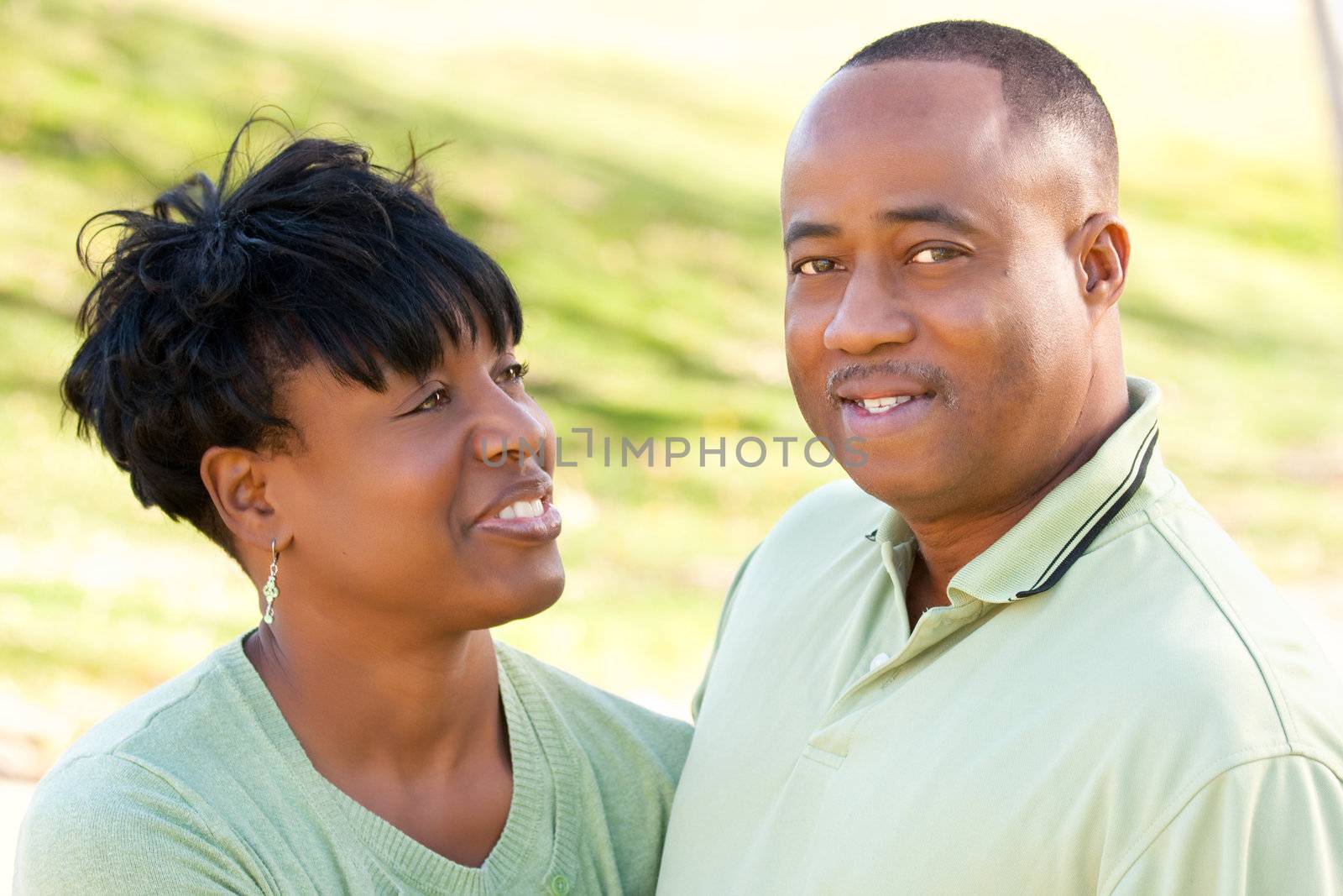 Attractive Happy African American Couple Posing in the Park.