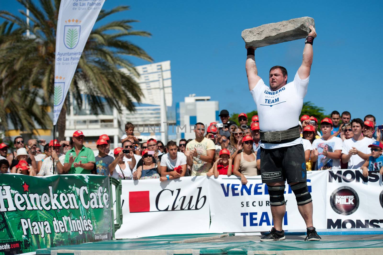 CANARY ISLANDS – SEPTEMBER 03: Jimmy Laureys from Belgium lifting a heavy stone during Strongman Champions League in Las Palmas September 03, 2011 in Canary Islands, Spain