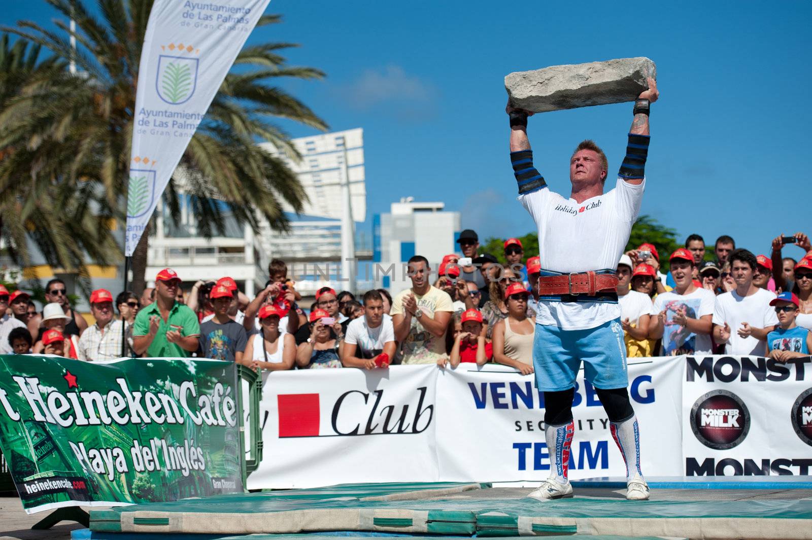 CANARY ISLANDS – SEPTEMBER 03: Tomi Lotta from Finland lifting a heavy stone during Strongman Champions League in Las Palmas September 03, 2011 in Canary Islands, Spain
