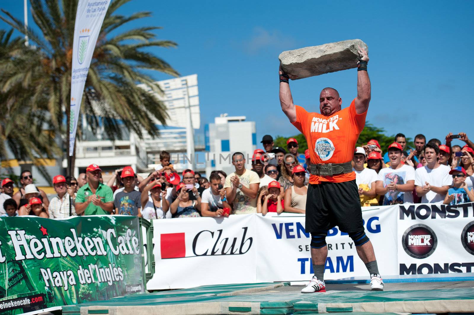 CANARY ISLANDS – SEPTEMBER 03: Ervin Katona from Serbia lifting a heavy stone during Strongman Champions League in Las Palmas September 03, 2011 in Canary Islands, Spain