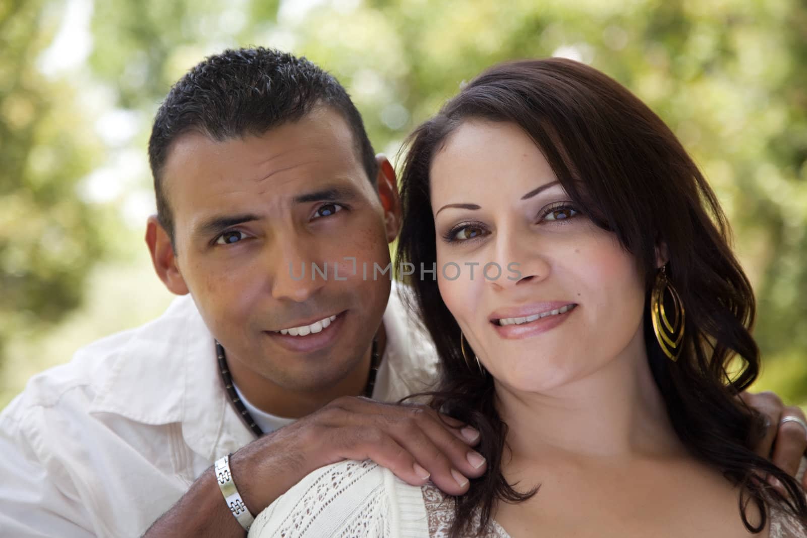 Attractive Hispanic Couple in the Park by Feverpitched