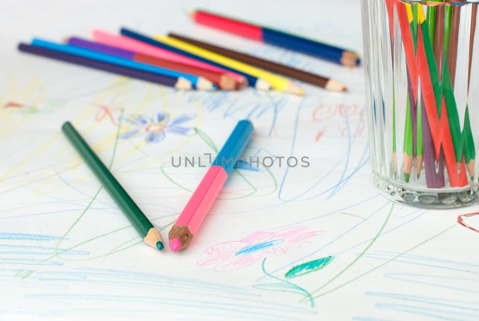 Colored pencils on a child's drawing