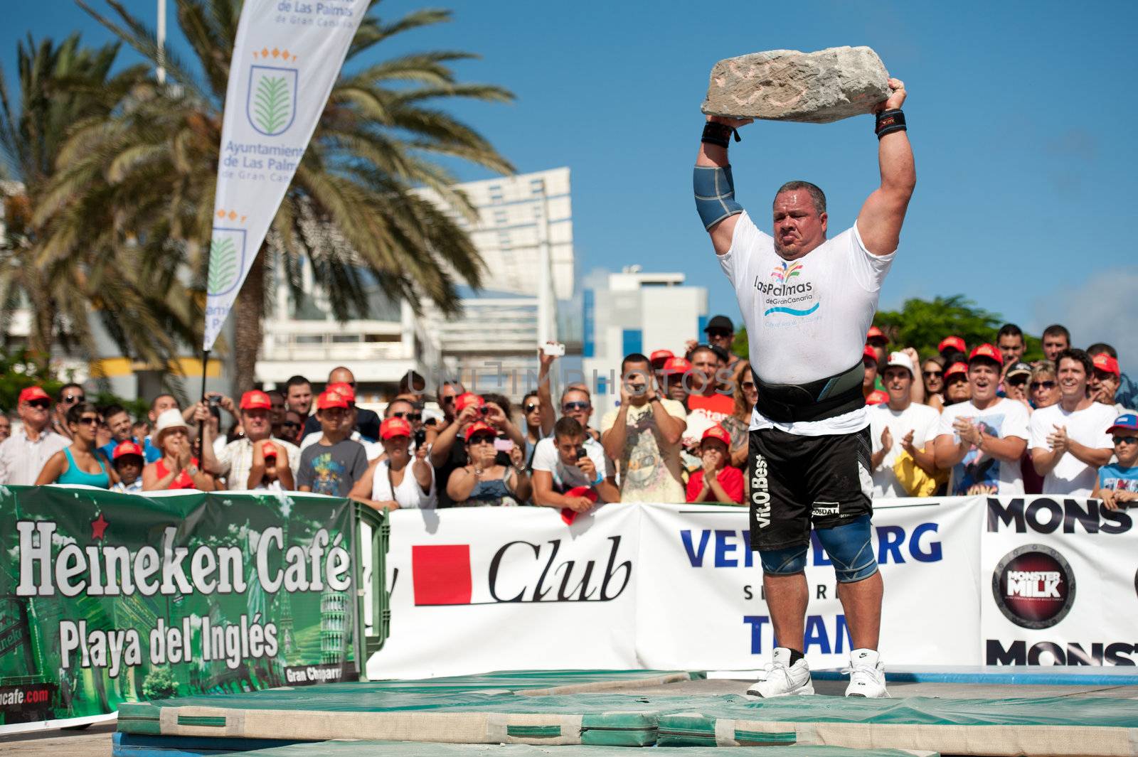 CANARY ISLANDS – SEPTEMBER 03: Juan Carlos Heredia from Spain lifting a heavy stone during Strongman Champions League in Las Palmas September 03, 2011 in Canary Islands, Spain