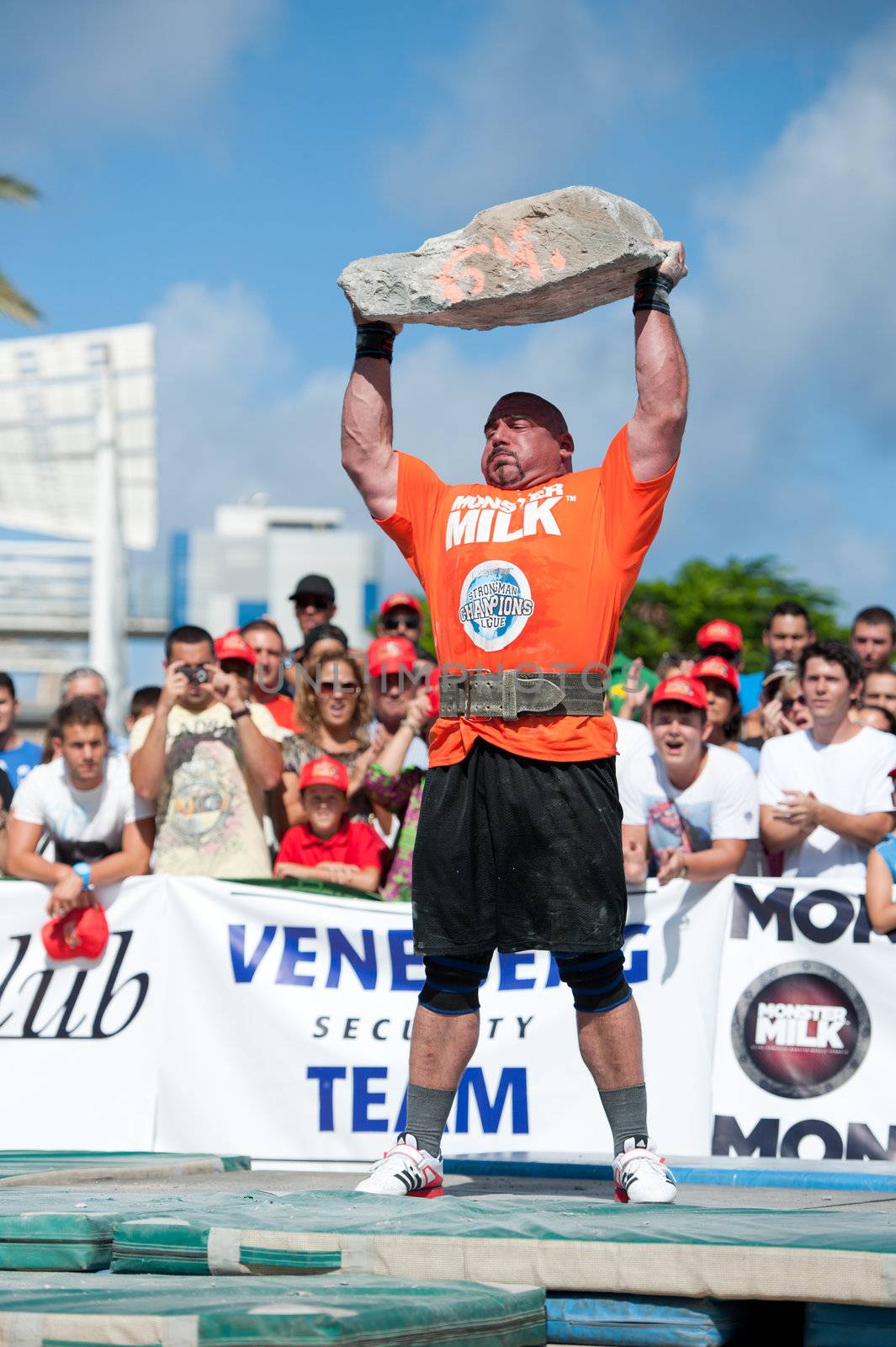 CANARY ISLANDS – SEPTEMBER 03: Ervin Katona from Serbia lifting a heavy stone during Strongman Champions League in Las Palmas September 03, 2011 in Canary Islands, Spain