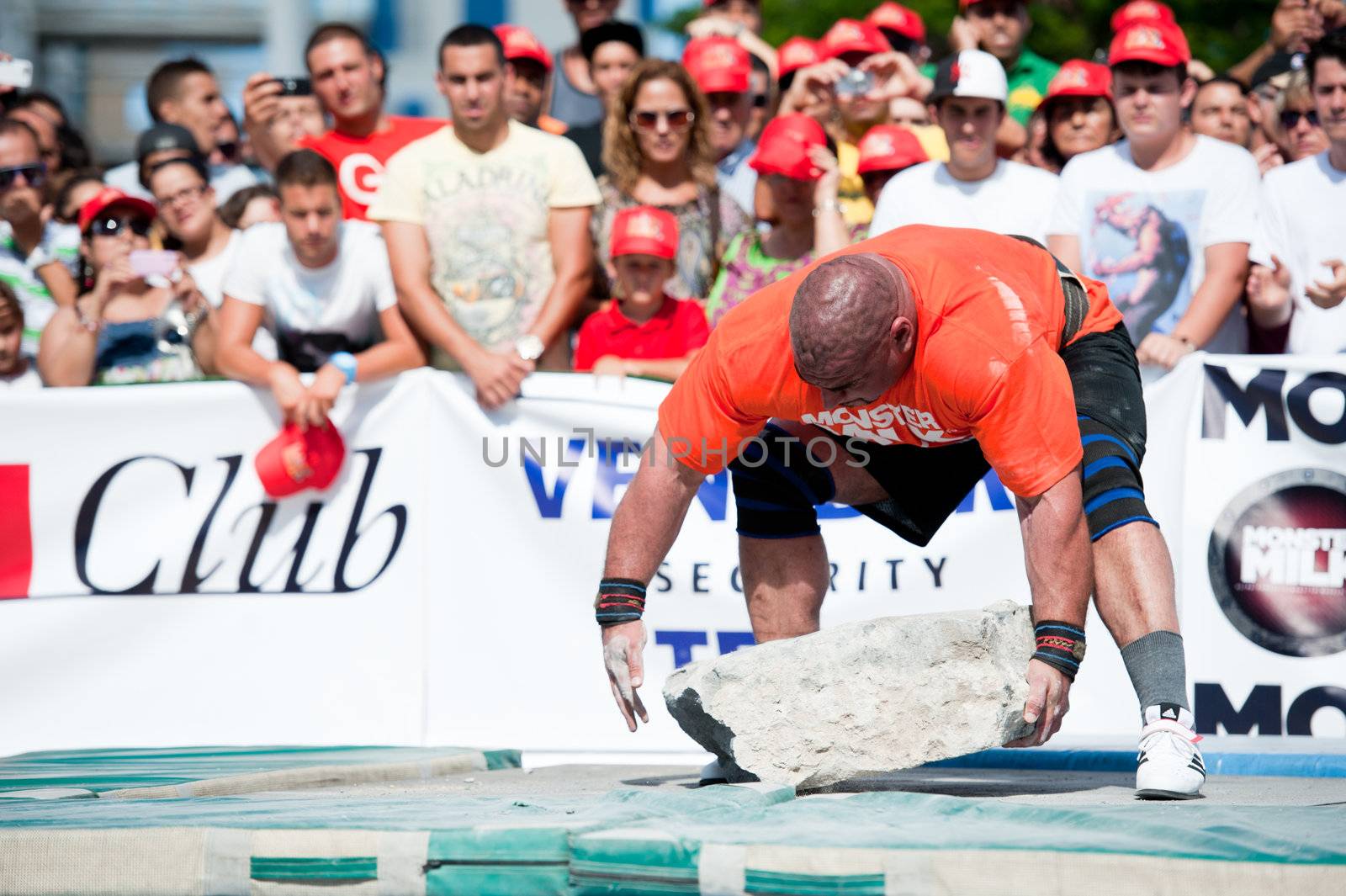 CANARY ISLANDS – SEPTEMBER 03: Ervin Katona from Serbia lifting a heavy stone during Strongman Champions League in Las Palmas September 03, 2011 in Canary Islands, Spain