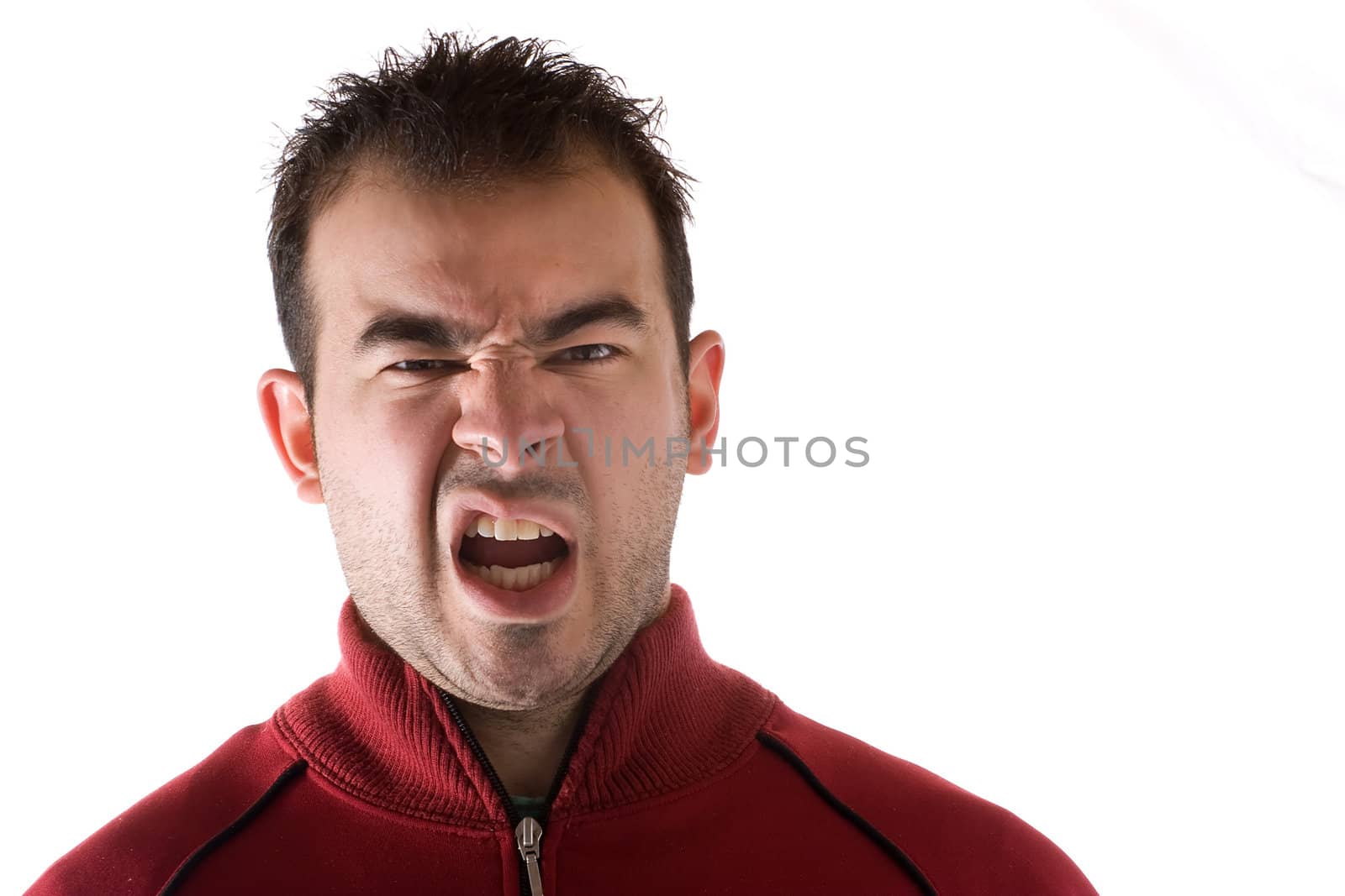Young man isolated over white with a disgusted look on his face.