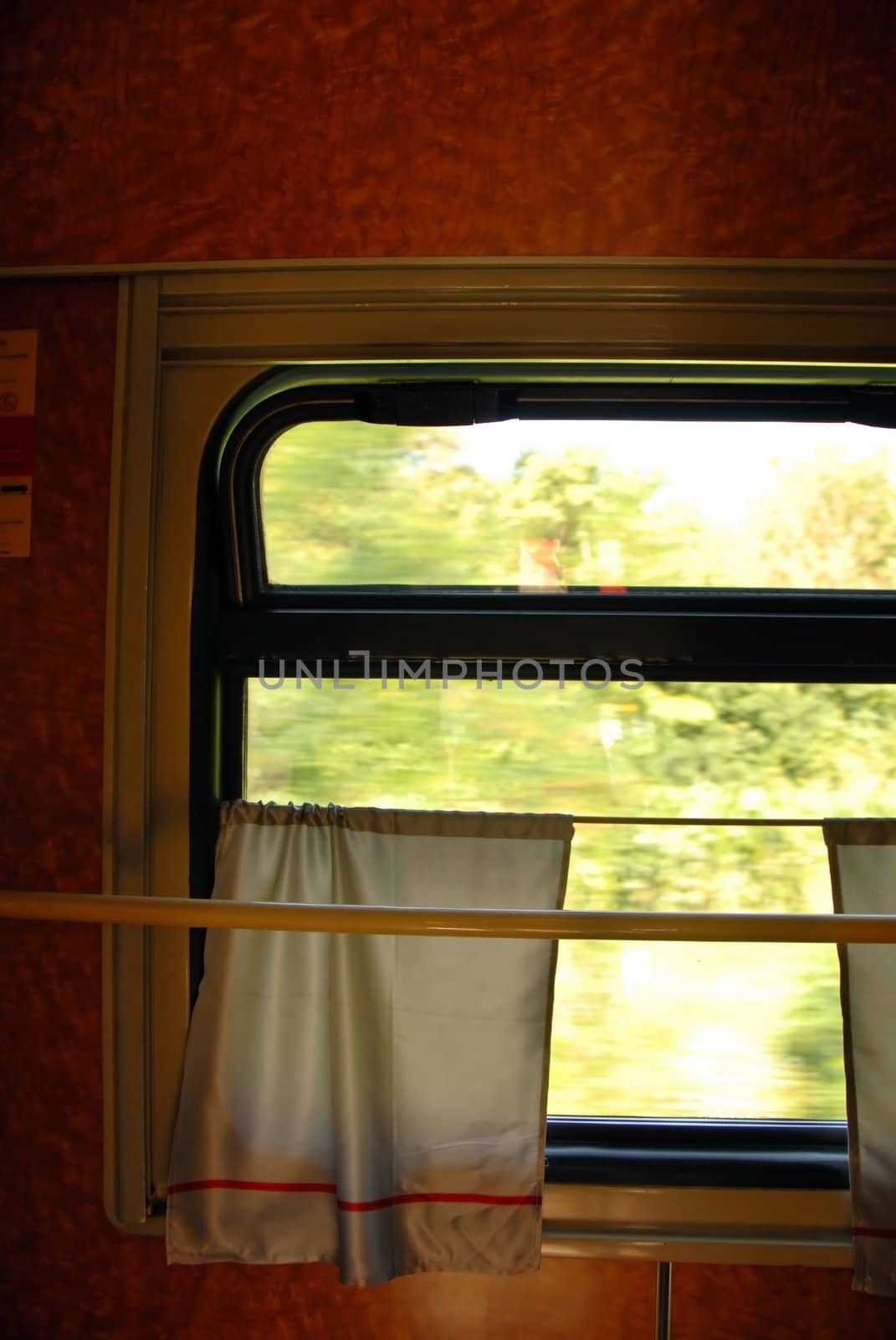window with curtain inside of train wagon