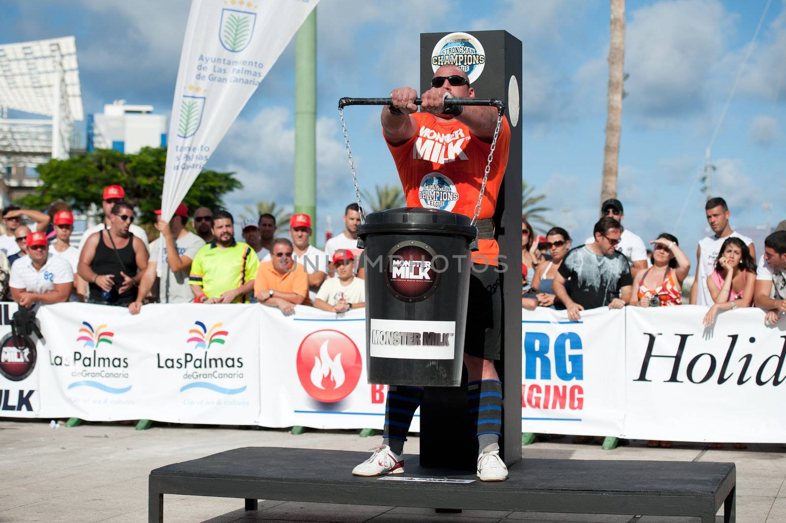 CANARY ISLANDS - SEPTEMBER 03: Ervin Katona from Serbia lifting a heavy trash can for longest possible time during Strongman Champions League in Las Palmas September 03, 2011 in Canary Islands, Spain