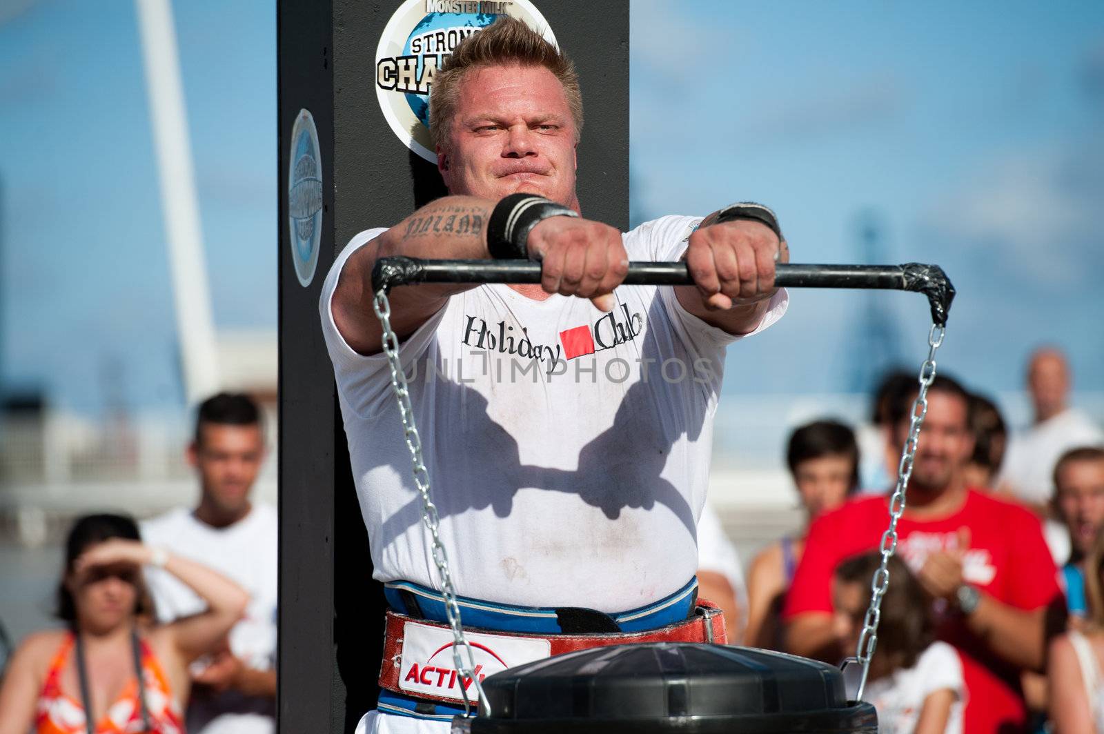 CANARY ISLANDS - SEPTEMBER 03: Tomi Lotta from Finland  lifting a heavy trash can for longest possible time during Strongman Champions League in Las Palmas September 03, 2011 in Canary Islands, Spain