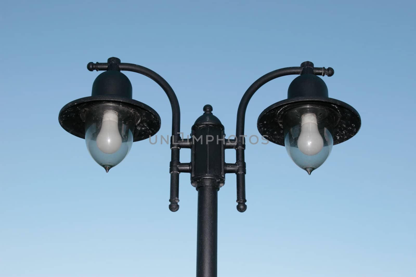 irish street light isolated on blue sky background with clipping path
