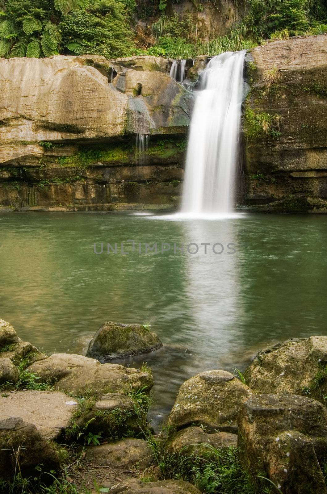 Beautiful waterfall with river in the forest.
