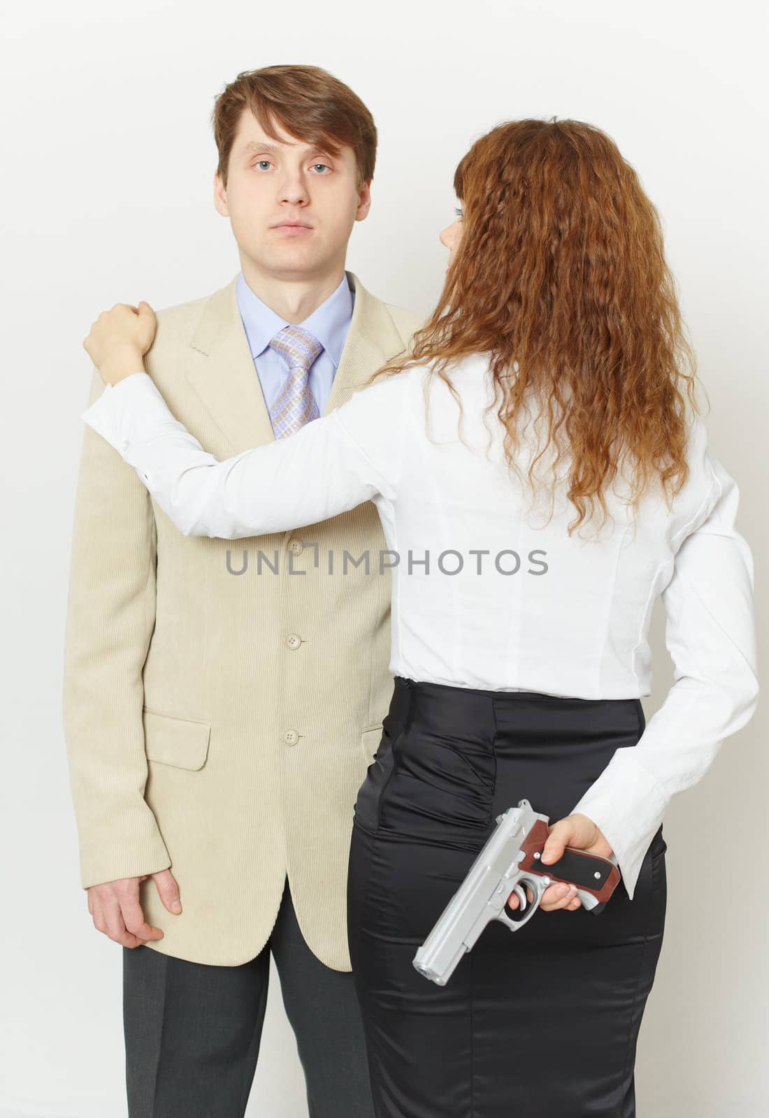 Pair of young men - the woman with a pistol and the man