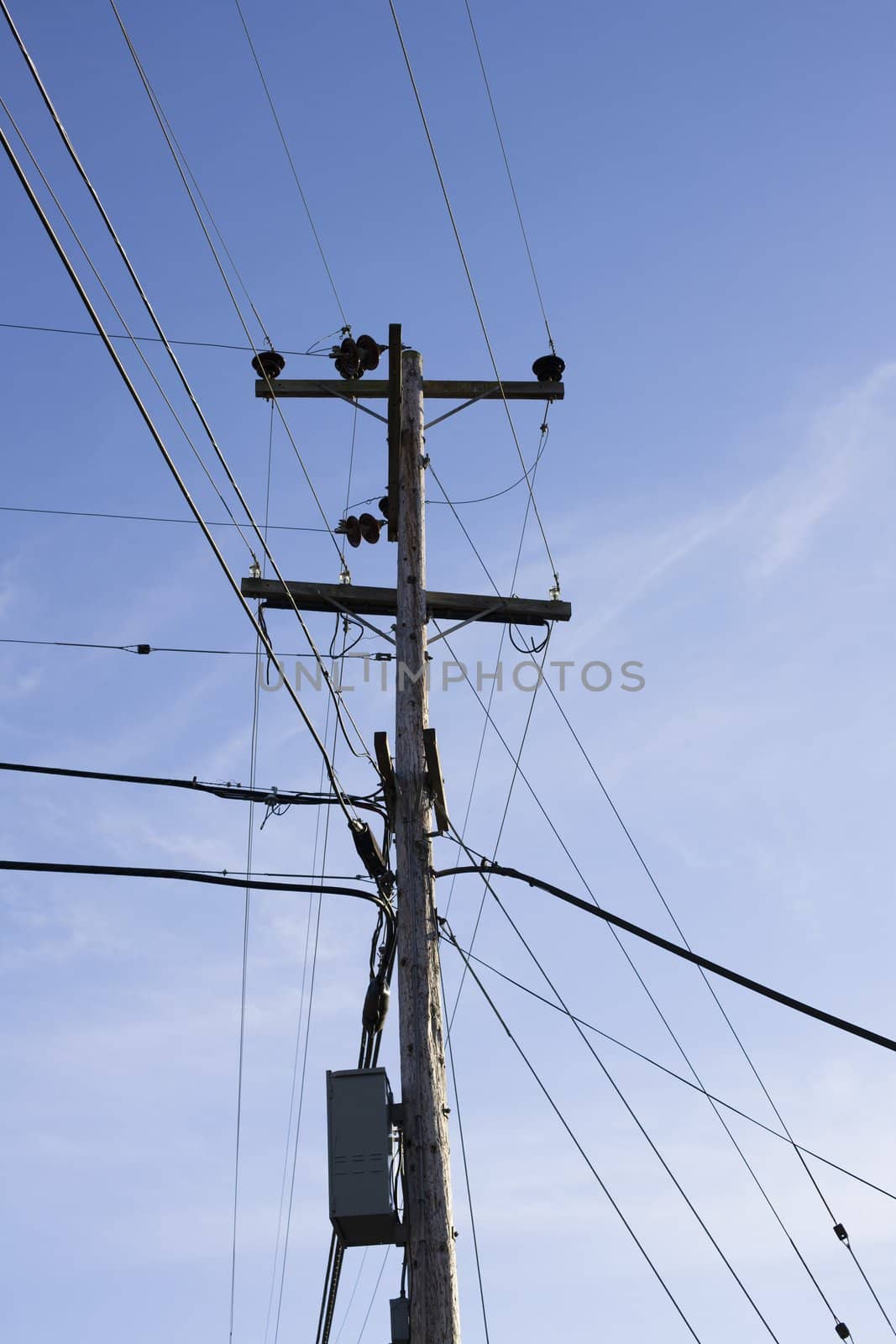 Power Pole and Power Lines in Front of a Bright Blue Sky