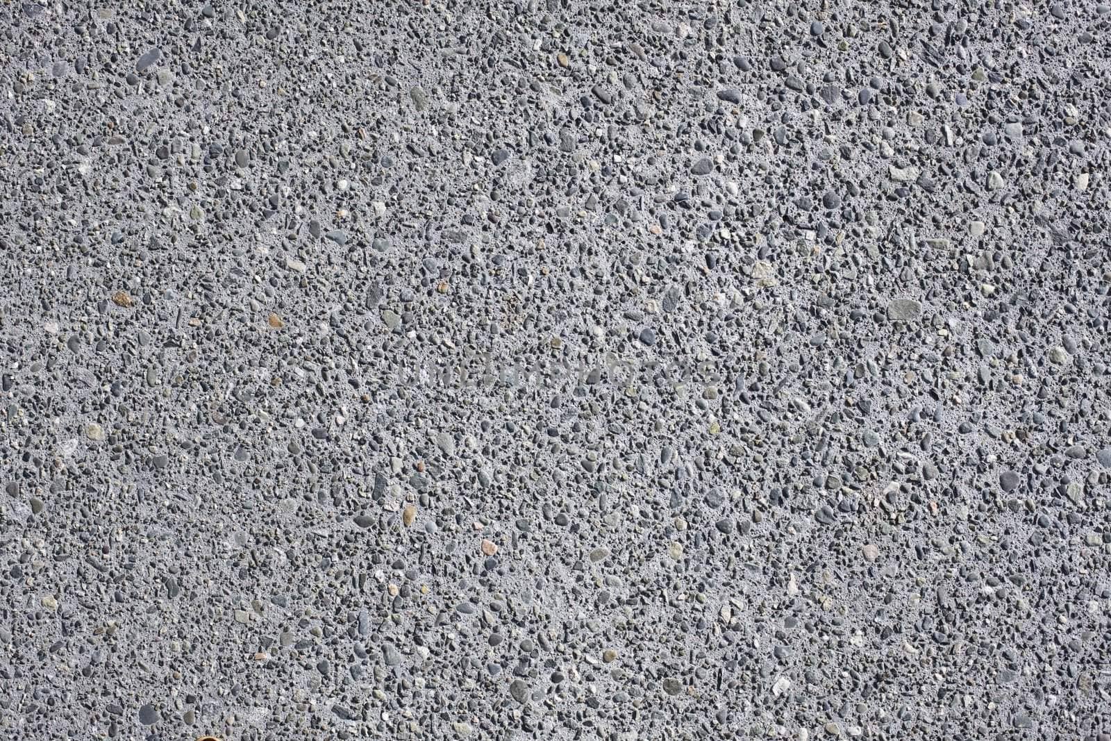 Closeup Detail of Gray Concrete With Stones